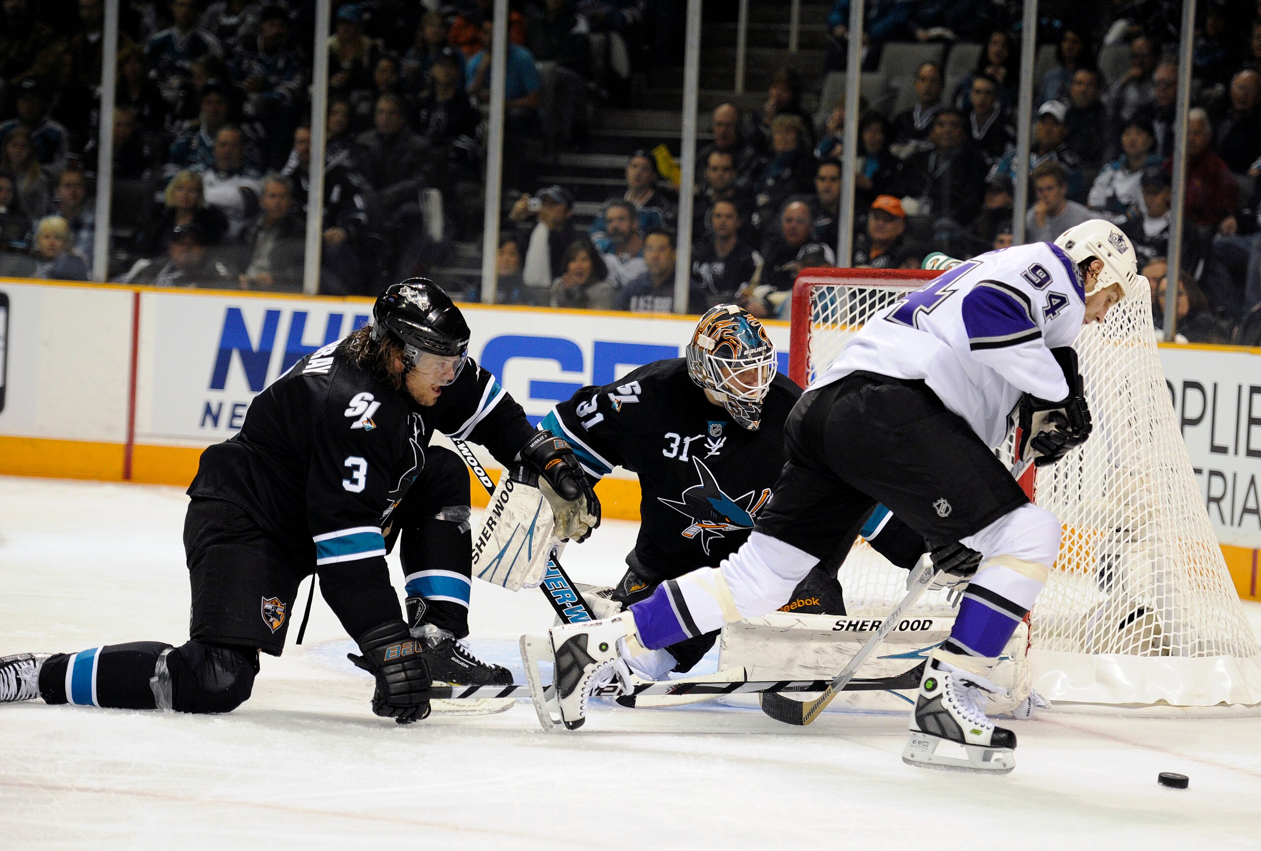 SAN JOSE, CA - APRIL 14: Antti Niemi #31 of the San Jose Sharks gets help from teammate Douglas Murray #3 defending his goal against Ryan Smyth #94 of the Los Angeles Kings in Game One of the Western Conference Quarterfinals  during the 2011 NHL Stanley C