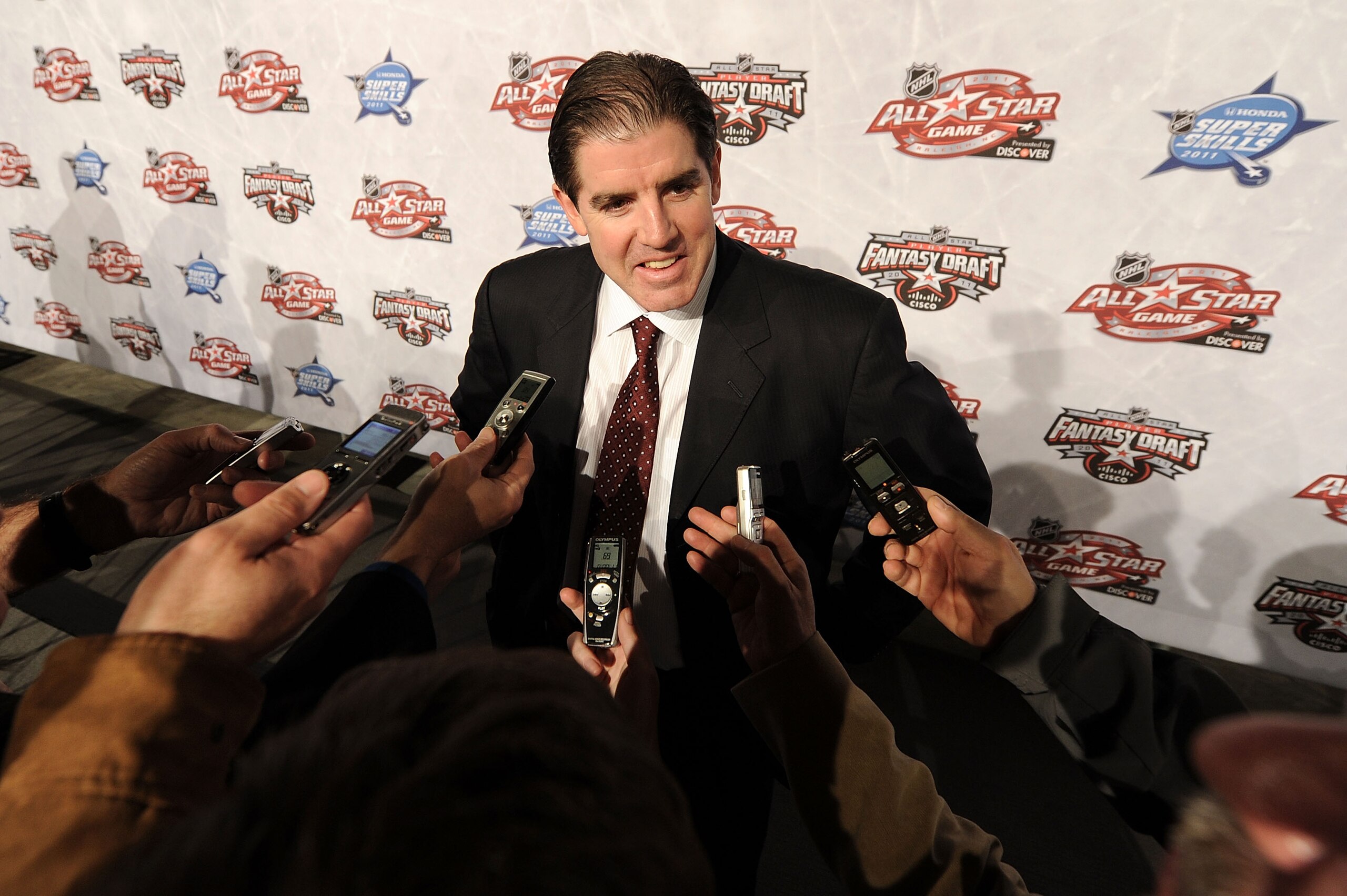 RALEIGH, NC - JANUARY 28:  Head coach Peter Laviolette of the Philadelphia Flyers answers questions during NHL All Star Player Media Availability apart of the 2011 NHL All-Star Weekend at the Raleigh Convention Center on January 28, 2011 in Raleigh, North