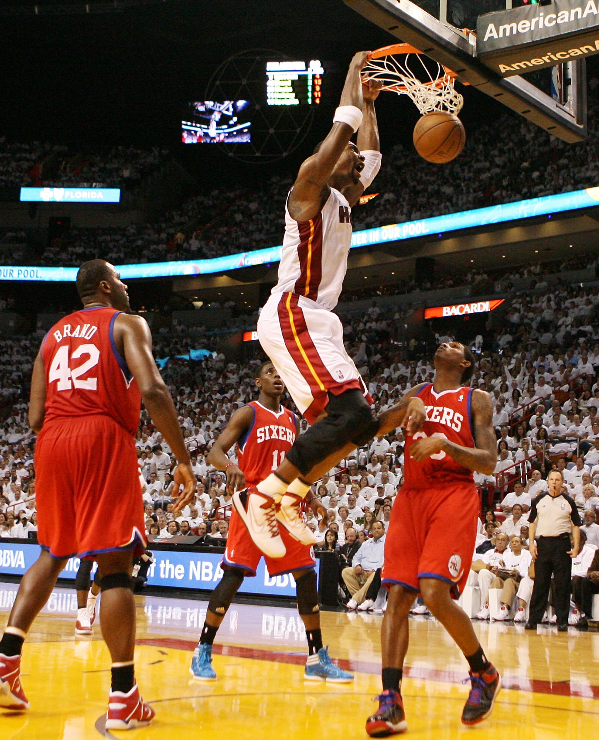 MIAMI, FL - APRIL 16:  Forward Chris Bosh #1 of the  Miami Heat dunks against the Philadelphia 76ers at the American Airlines Arena in game one of the Eastern Conference Quarterfinals in the 2011 NBA Playoffs on April 16, 2011 in Miami, Florida. NOTE TO U