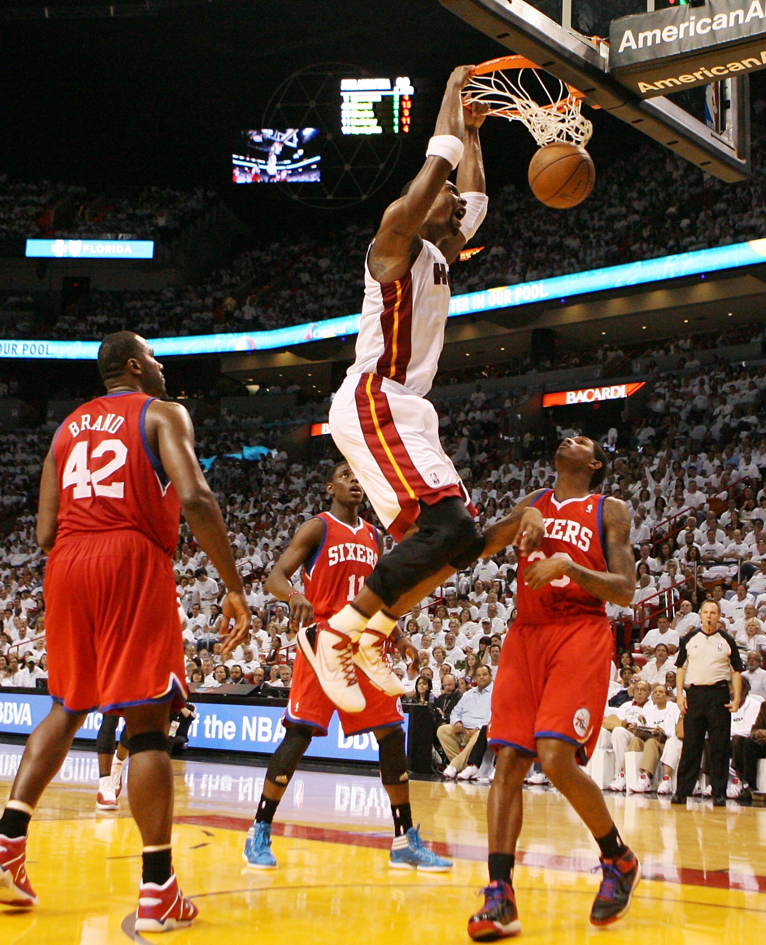 MIAMI, FL - APRIL 16:  Forward Chris Bosh #1 of the  Miami Heat dunks against the Philadelphia 76ers at the American Airlines Arena in game one of the Eastern Conference Quarterfinals in the 2011 NBA Playoffs on April 16, 2011 in Miami, Florida. NOTE TO U