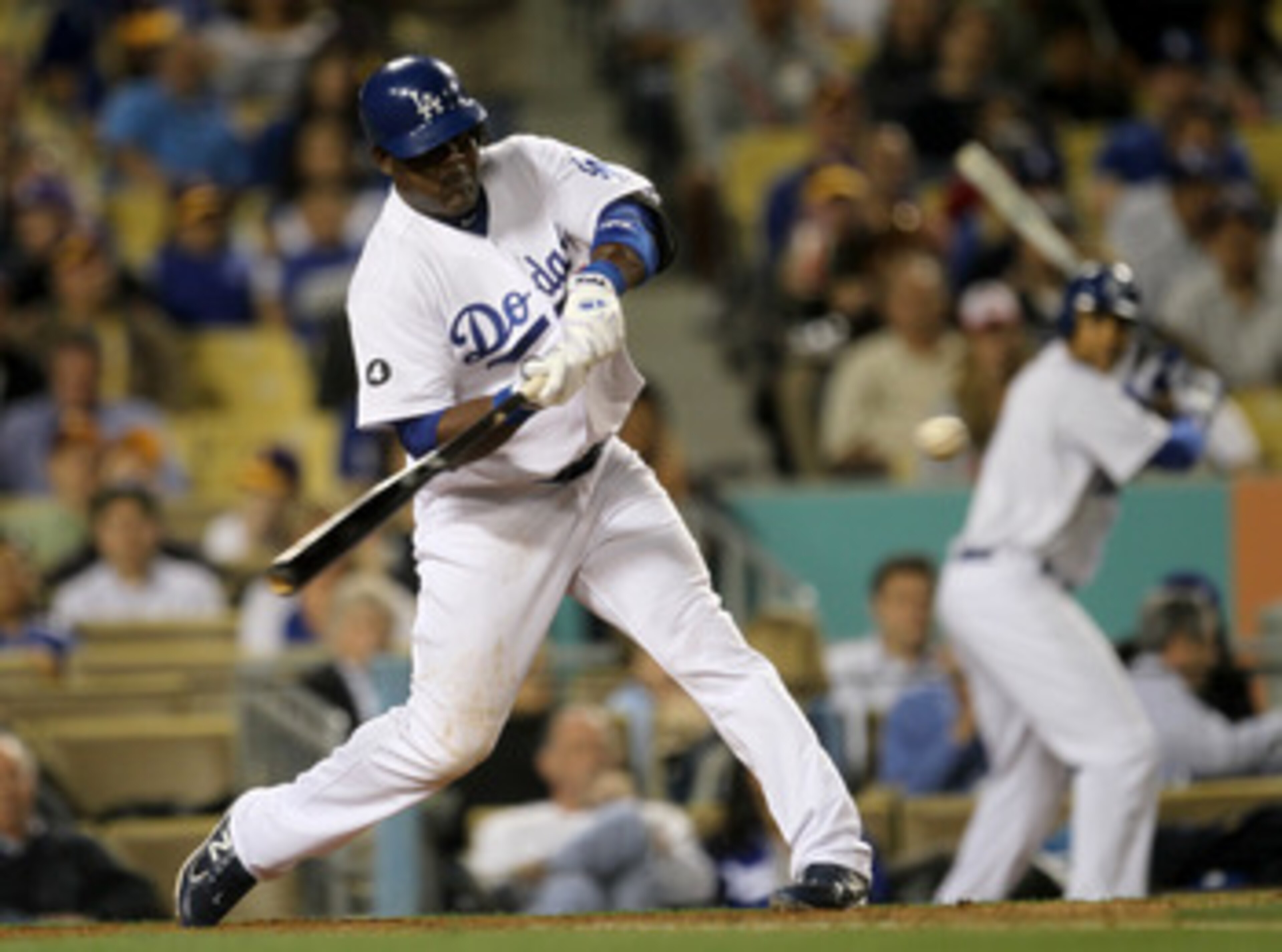 LOS ANGELES - APRIL 14:   Juan Uribe #5 of the Los Angeles Dodgers hits an RBI double in the third inning against the St Louis Cardinals on April 14, 2011 at Dodger Stadium in Los Angeles, California.  (Photo by Stephen Dunn/Getty Images)