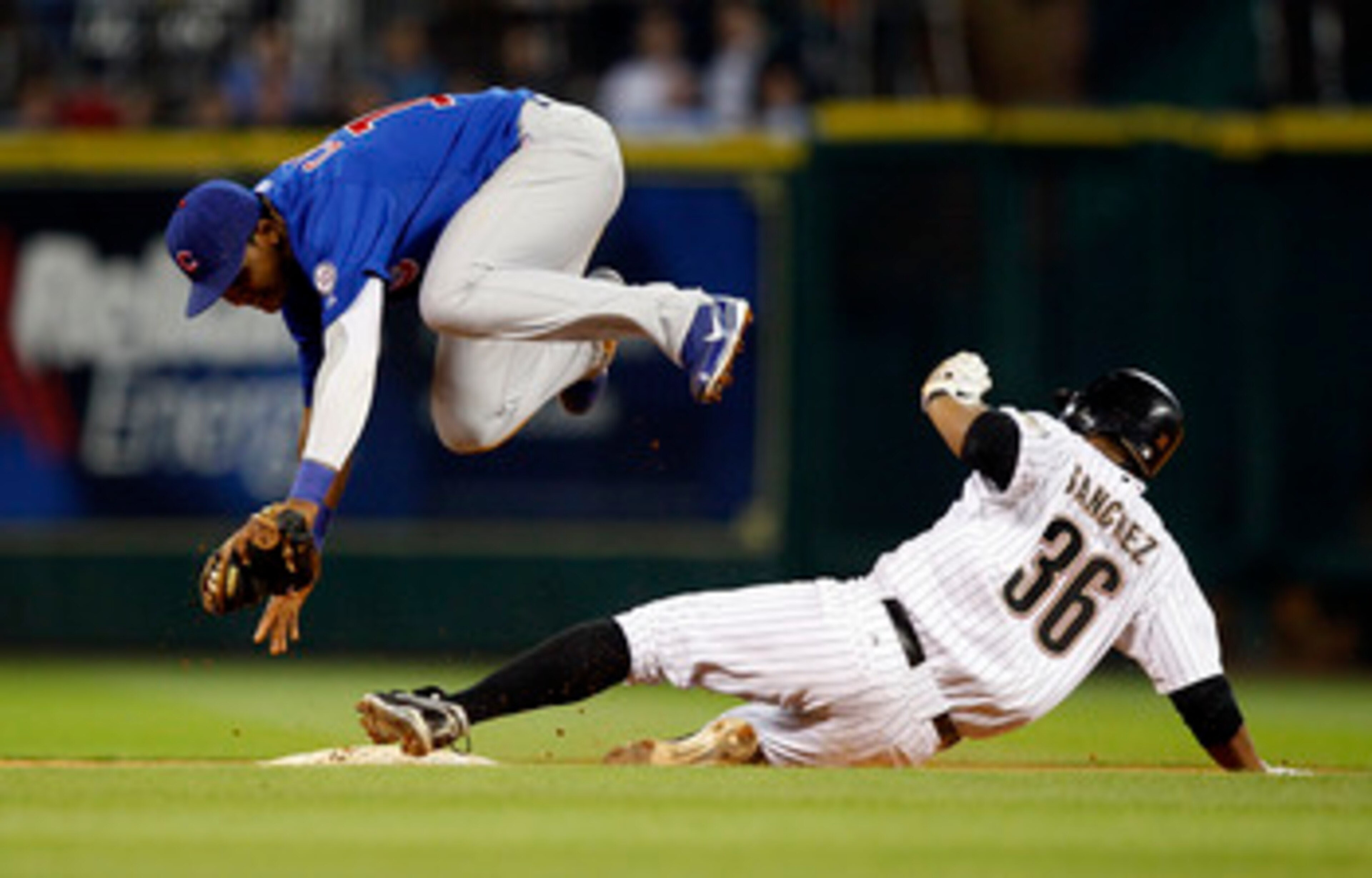 HOUSTON - APRIL 12:  Angel Sanchez #36 is forced out at second base as shortstop Starlin Castro #13 of the Chicago Cubs avoids the slide at Minute Maid Park on April 12, 2011 in Houston, Texas.  (Photo by Bob Levey/Getty Images)