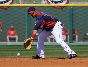 GOODYEAR, AZ - FEBRUARY 27:  Orlando Cabrera #20 of the Cleveland Indians fields a ground ball against the Cincinnati Reds at Goodyear Ballpark on February 27, 2011 in Goodyear, Arizona.  (Photo by Norm Hall/Getty Images)
