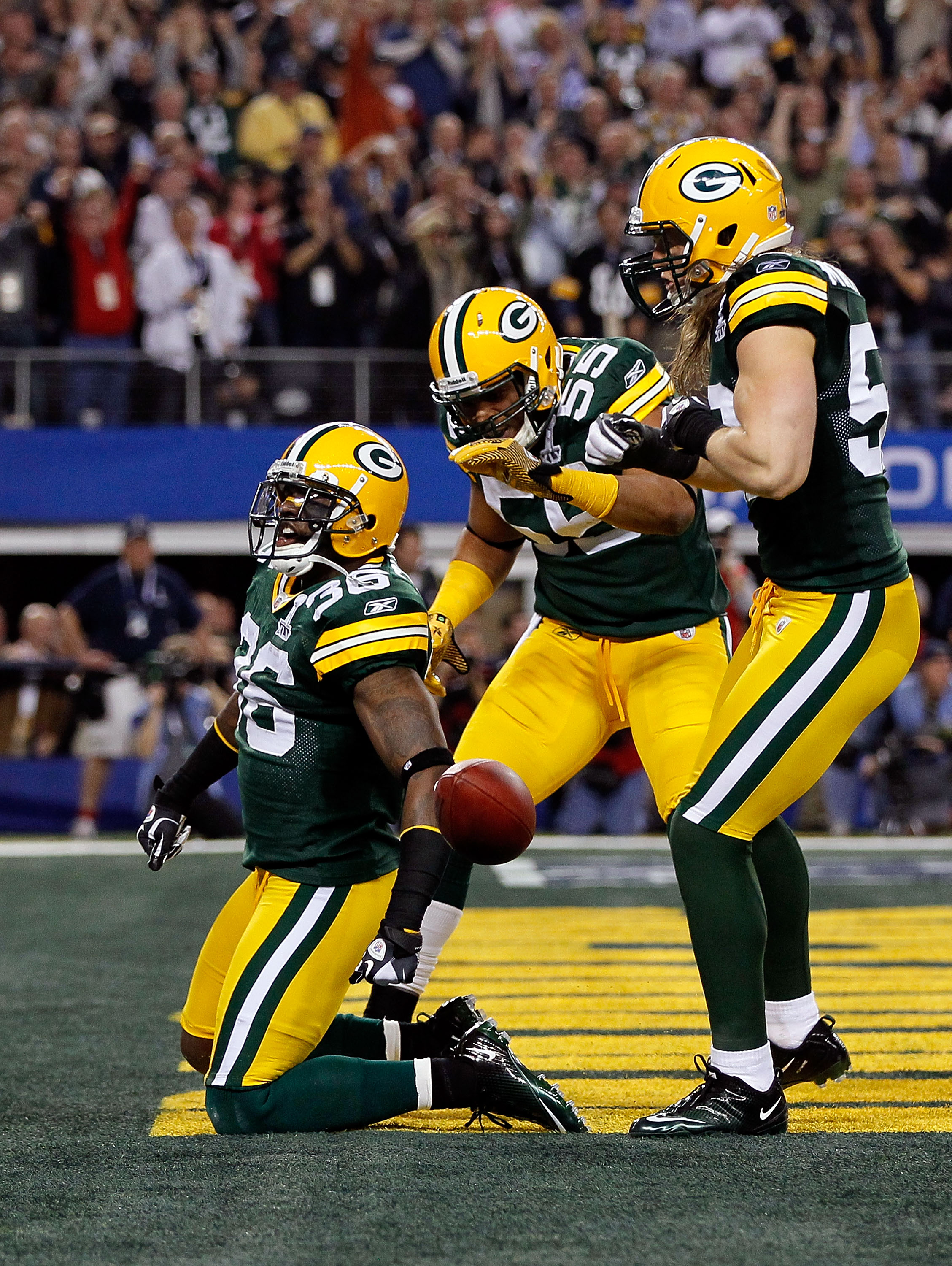 ARLINGTON, TX - FEBRUARY 06:  (L-R) Nick Collins #36, Desmond Bishop #55 and Clay Matthews #52 of the Green Bay Packers celebrate after Collins scored a touchdown on an interception return against the Pittsburgh Steelers during Super Bowl XLV at Cowboys S