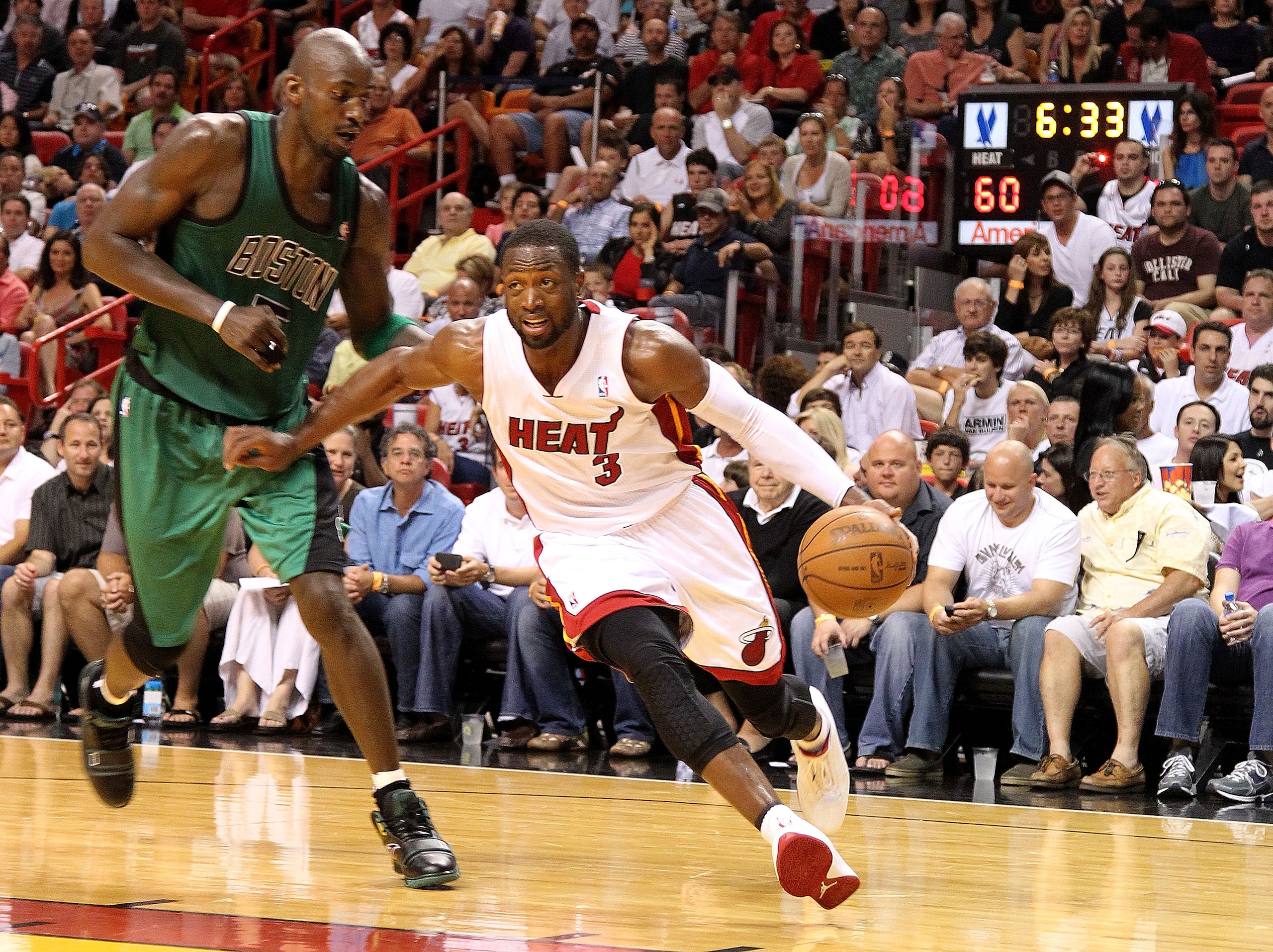 MIAMI, FL - APRIL 10: Dwyane Wade #3 of the Miami Heat drives on Kevin Garnett #5 of the Boston Celtics during a game at American Airlines Arena on April 10, 2011 in Miami, Florida. NOTE TO USER: User expressly acknowledges and agrees that, by downloadi MIAMI, FL - APRIL 10: Dwyane Wade #3 of the Miami Heat drives on Kevin Garnett #5 of the Boston Celtics during a game at American Airlines Arena on April 10, 2011 in Miami, Florida. NOTE TO USER: User expressly acknowledges and agrees that, by downloadi