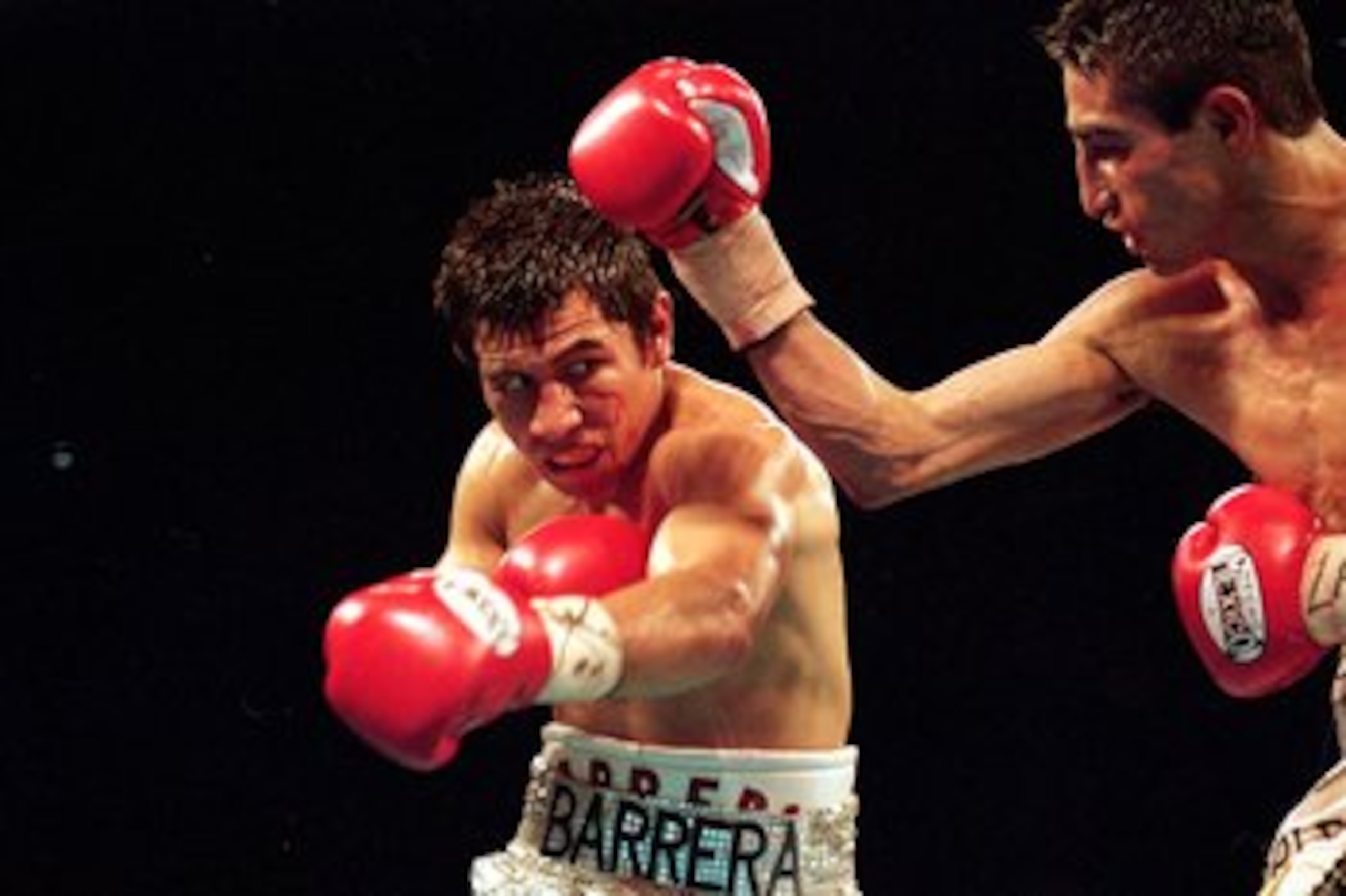19 Feb 2000: Marco Barrera makes a left swing during the WBC/WBO Super Bantamwight Championship against Erik Morales in Las Vegas, Nevada. Morales won by a decision in the 12th round. Mandatory Credit: Jed Jacobsohn  /Allsport