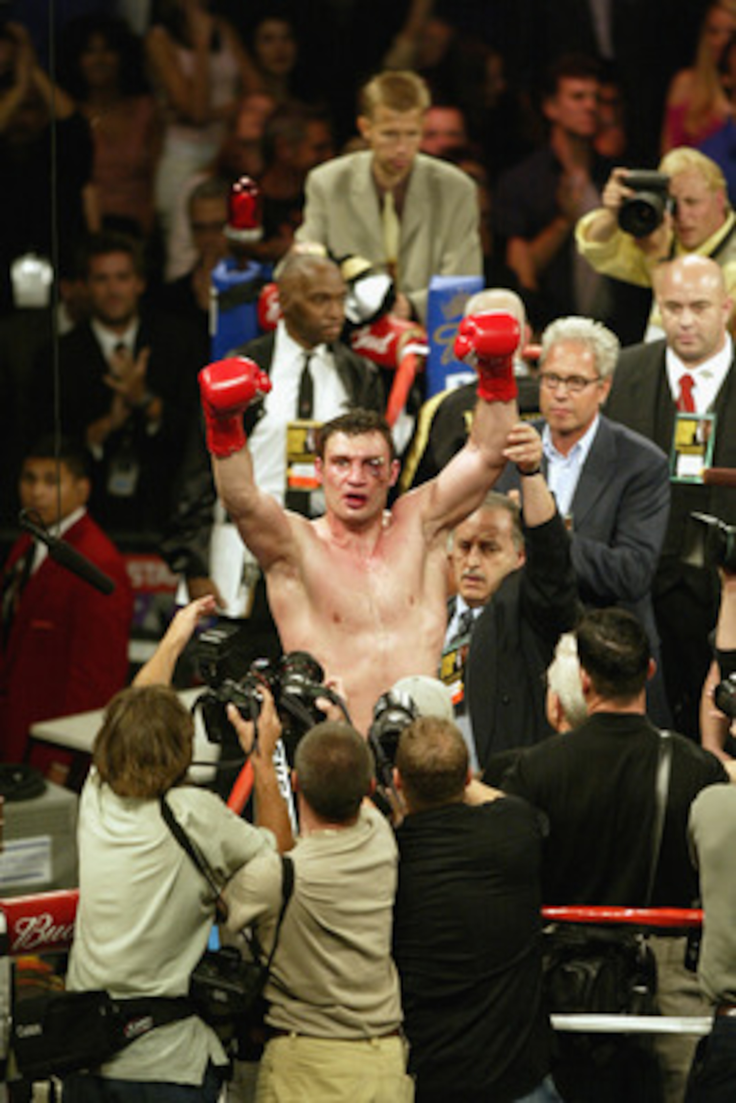 LOS ANGELES - JUNE 21:  Vitali Klitschko raises his hands in the air to the crowd after the WBC and IBO World Heavyweight Championship bout against Lennox Lewis at the Staples Center on June 21, 2003 in Los Angeles, California.  Lennox Lewis (41-2-1) defe