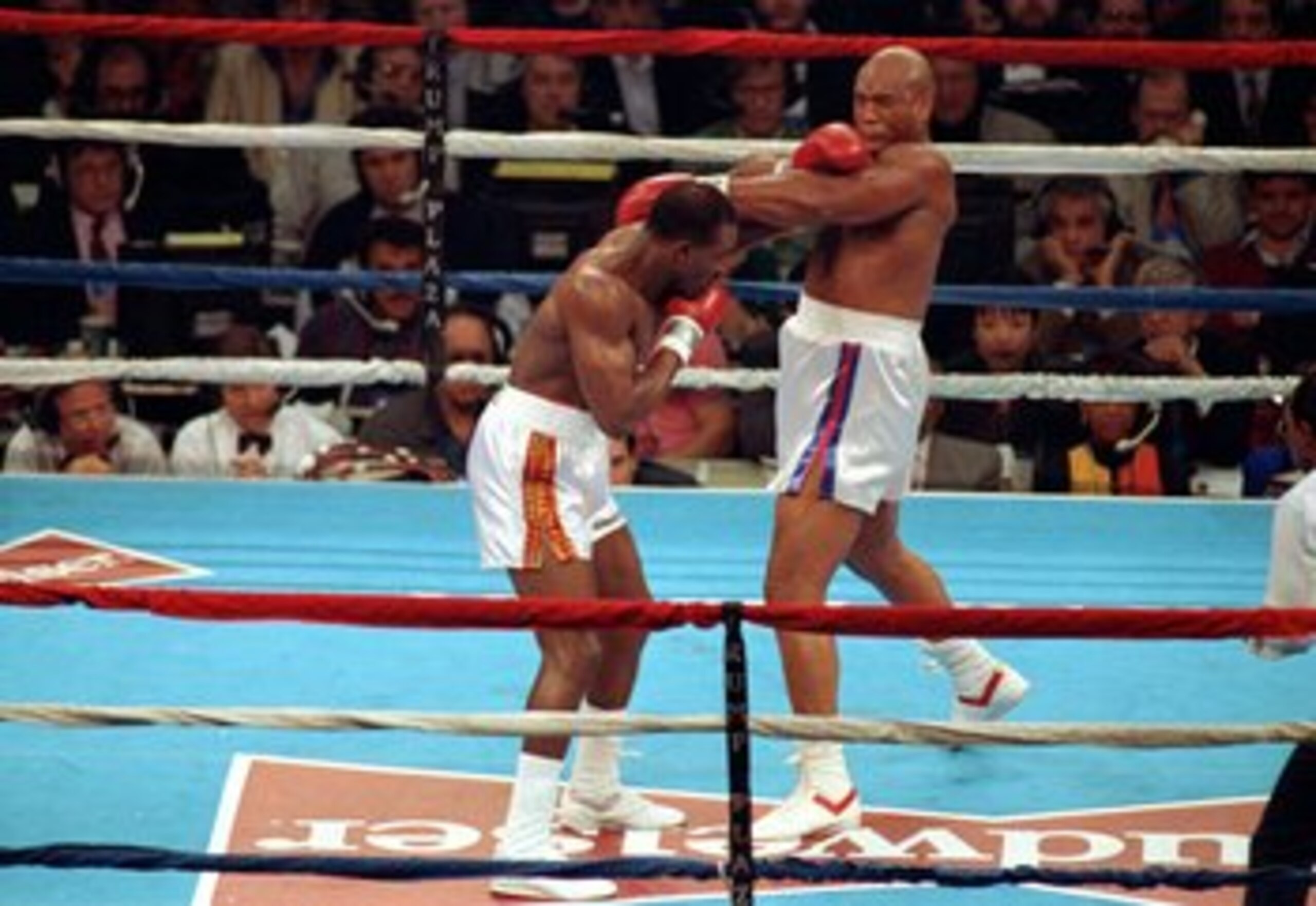 19 Apr 1991:  Evander Holyfield lands a left punch during a fight against George Foreman in Atlantic City, New Jersey. Mandatory Credit: Rick Stewart  /Allsport