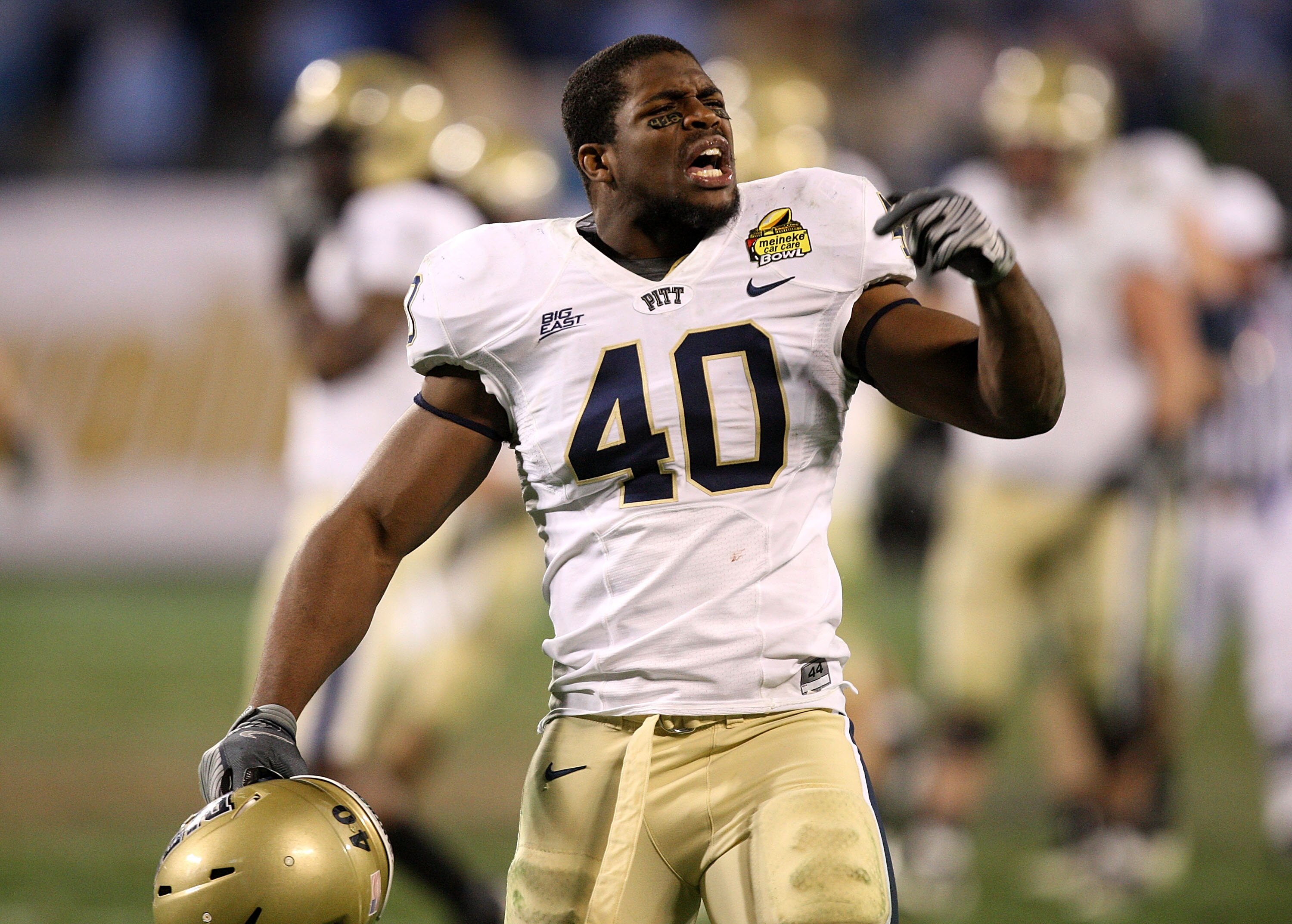 CHARLOTTE, NC - DECEMBER 26:  Dan Mason #40 of the Pittsburgh Panthers celebrates after a 19-17 victory over the North Carolina Tar Heels during their game on December 26, 2009 in Charlotte, North Carolina.  (Photo by Streeter Lecka/Getty Images)
