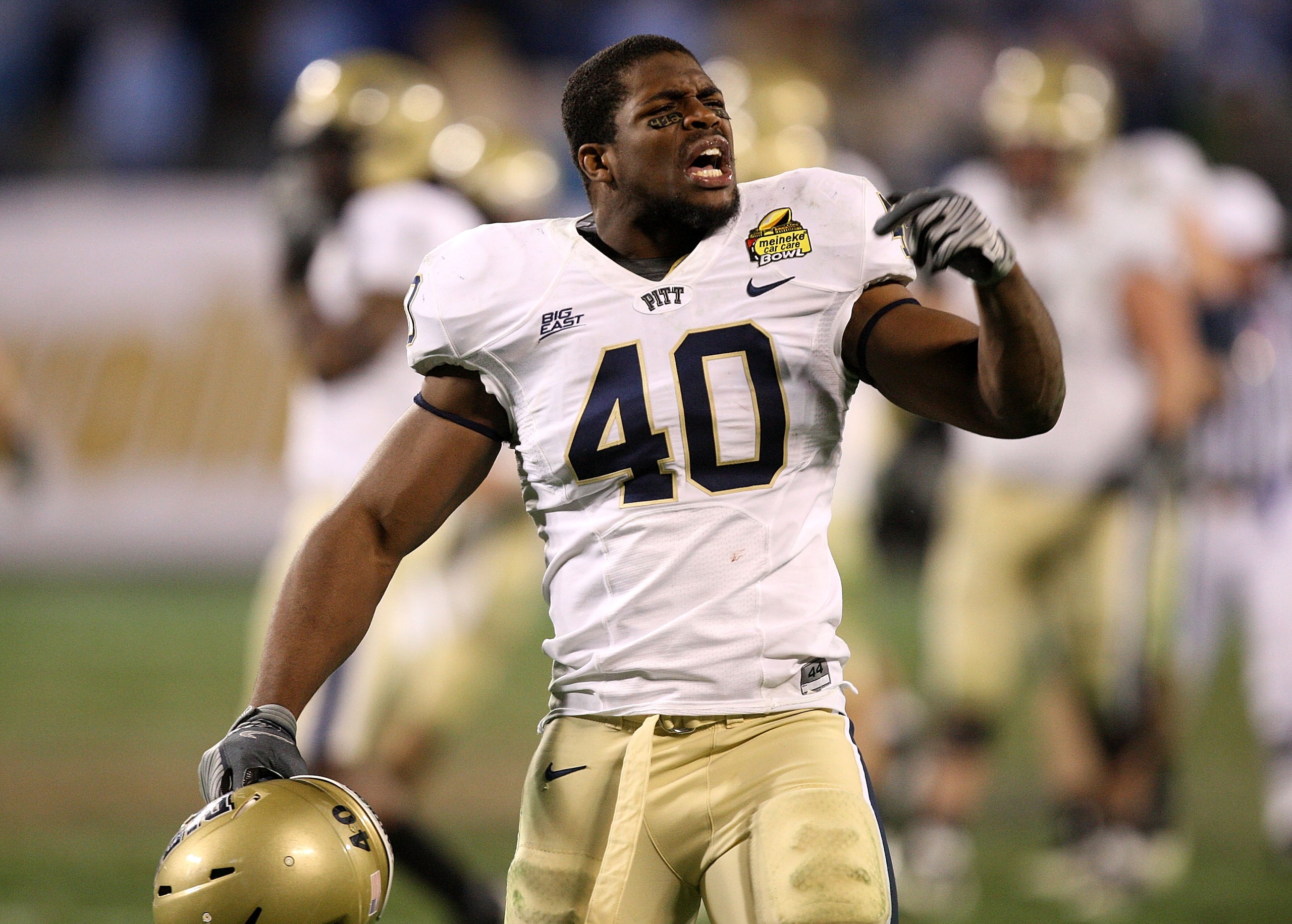 CHARLOTTE, NC - DECEMBER 26:  Dan Mason #40 of the Pittsburgh Panthers celebrates after a 19-17 victory over the North Carolina Tar Heels during their game on December 26, 2009 in Charlotte, North Carolina.  (Photo by Streeter Lecka/Getty Images)