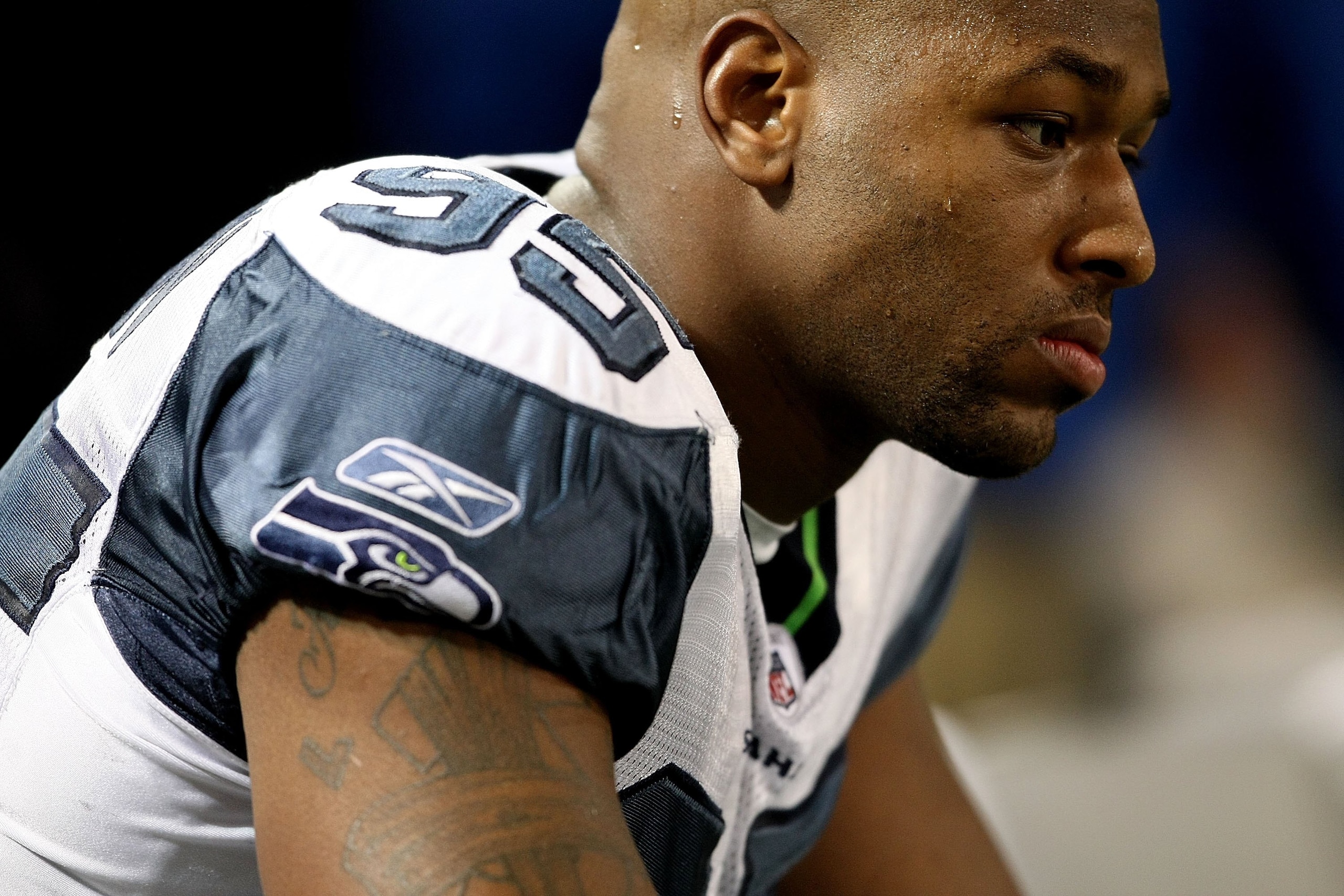 MINNEAPOLIS - NOVEMBER 22:  Lawrence Jackson #95 of the Seattle Seahawks sits on the bench against the Minnesota Vikings at Hubert H. Humphrey Metrodome on November 22, 2009 in Minneapolis, Minnesota.  (Photo by Nick Laham/Getty Images)