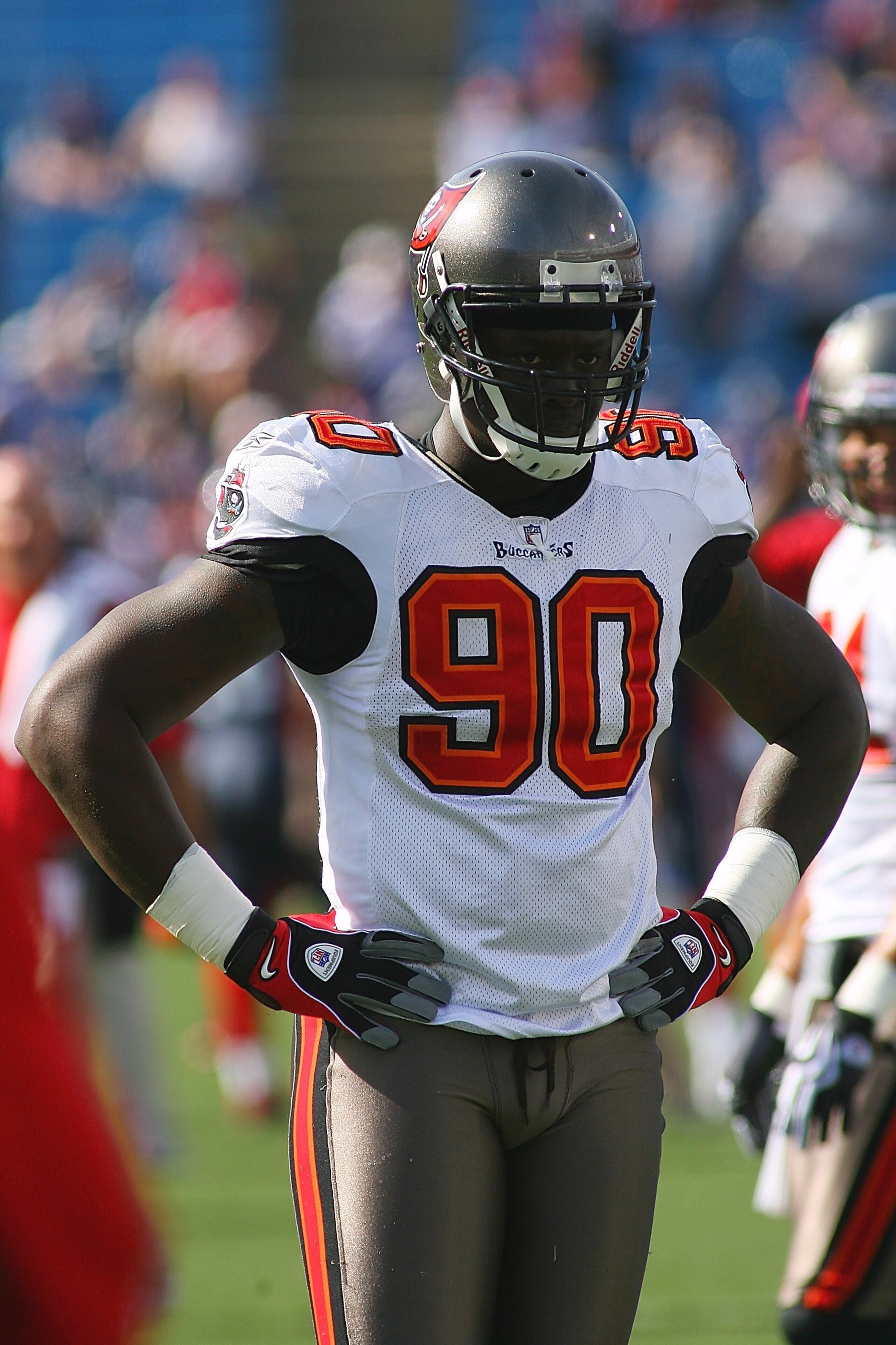 ORCHARD PARK, NY - SEPTEMBER 20:  Defensive end Gaines Adams #90 of the Tampa Bay Buccaneers takes a break from the action during the game against the Buffalo Bills at Ralph Wilson Stadium on September 20, 2009 in Orchard Park, New York.  The Bills won 33