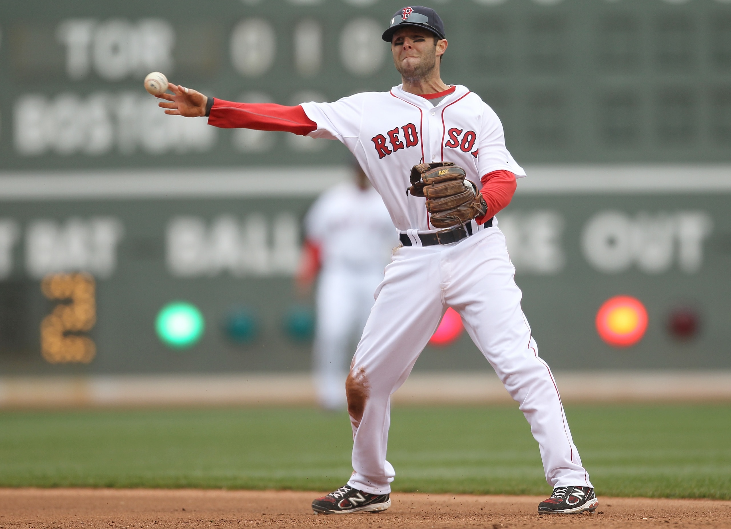BOSTON, MA - APRIL 16, 2011: Dustin Pedroia #15 of the Boston Red Sox makes the assist against the Toronto Blue Jays at Fenway Park April 16, 2011 in Boston, Massachusetts. (Photo by Jim Rogash/Getty Images)
