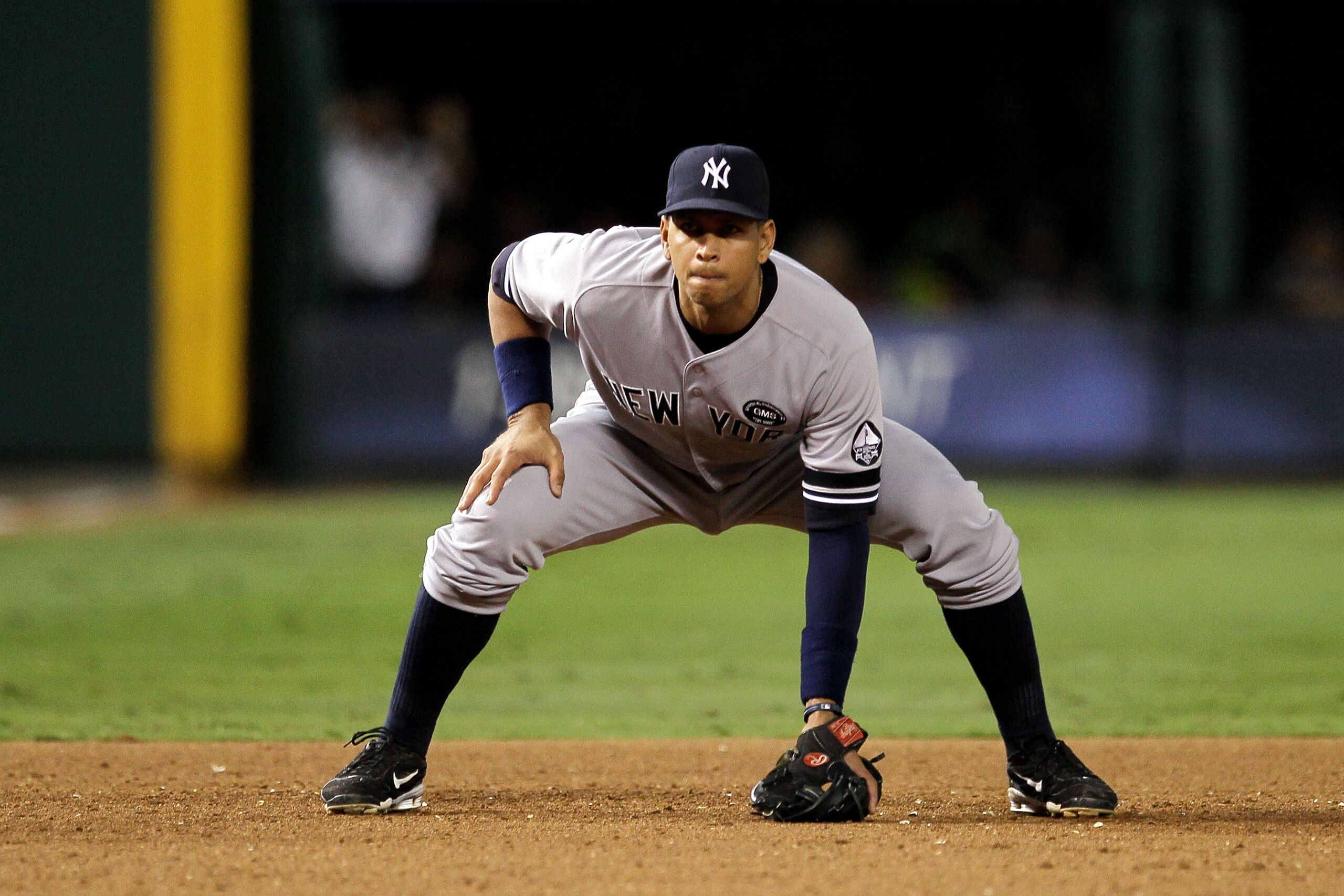 ARLINGTON, TX - OCTOBER 15:  Alex Rodriguez #13 of the New York Yankees defends third base against the Texas Rangers in Game One of the ALCS during the 2010 MLB Playoffs at Rangers Ballpark in Arlington on October 15, 2010 in Arlington, Texas. The Yankees