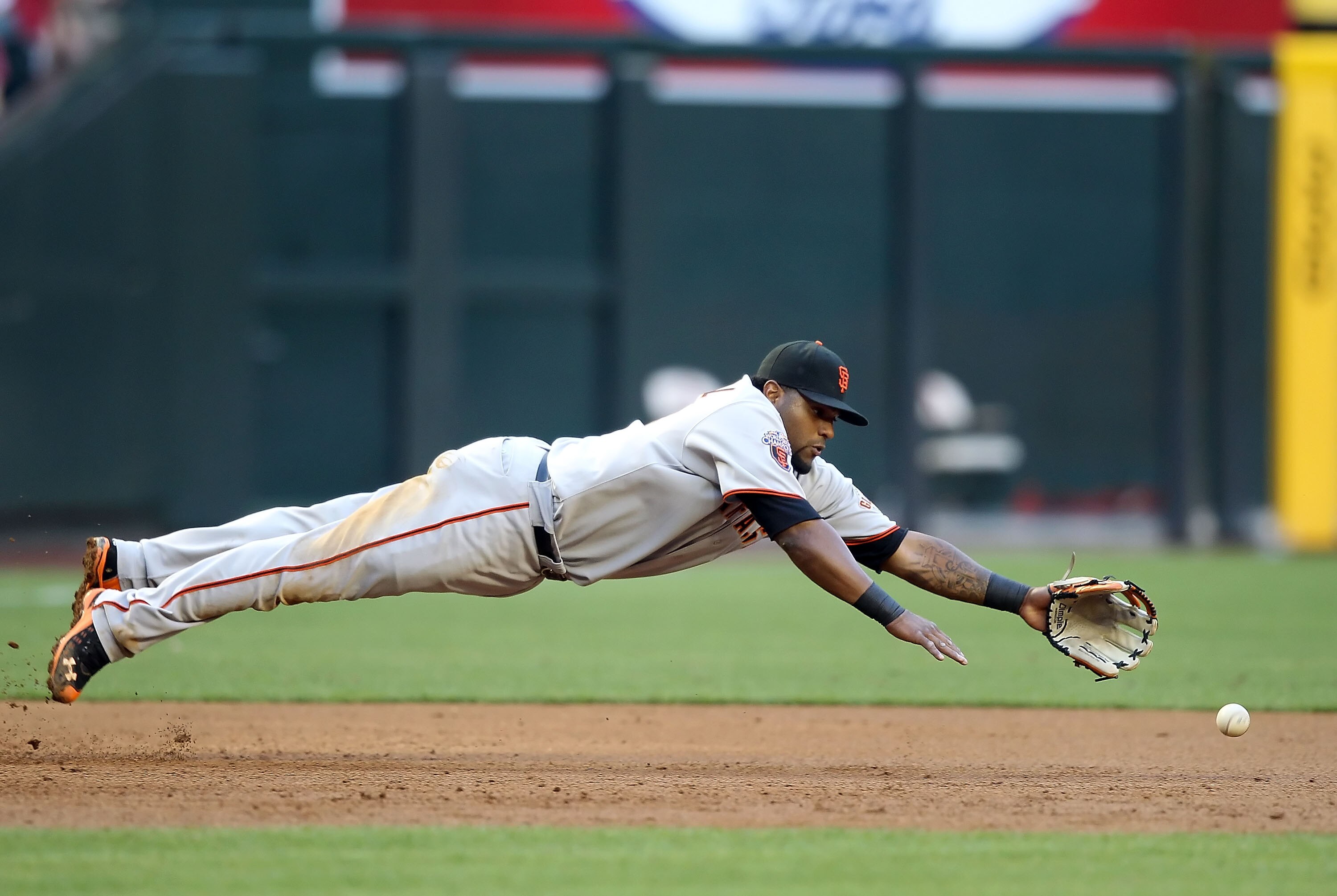 PHOENIX, AZ - APRIL 16:  Infielder Pablo Sandoval #48 of the San Francisco Giants dives as he attempts to field a single hit by Melvin Mora (not pictured) of the Arizona Diamondbacks during the second inning of the Major League Baseball game at Chase Fiel