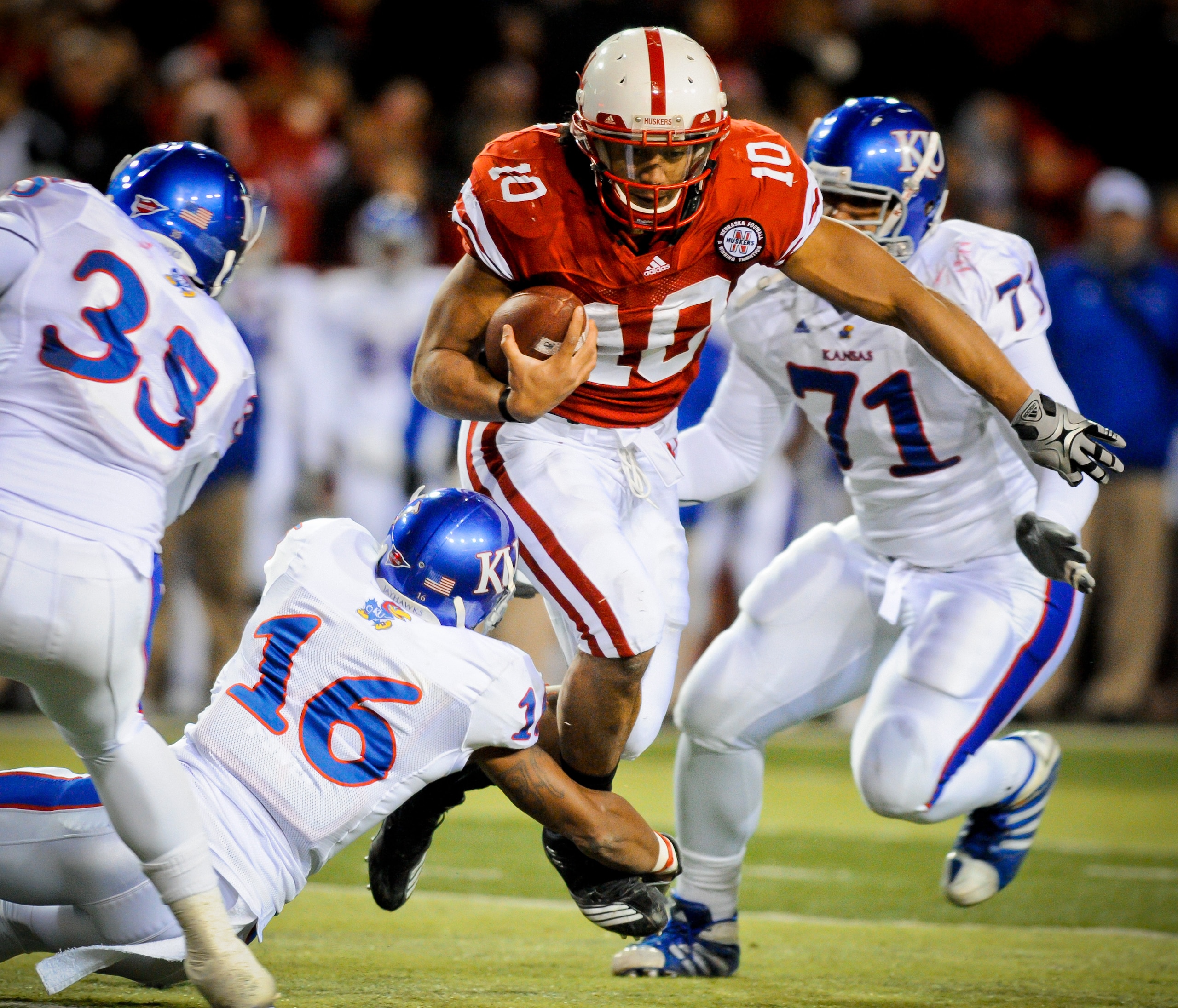 LINCOLN, NE - NOVEMBER 13: Running back Roy Helu Jr. #10 of the Nebraska Cornhuskers weaves his way through the Kansas Jayhawk defense during second half action of their game at Memorial Stadium on November 13, 2010 in Lincoln, Nebraska. Nebraska Defeated LINCOLN, NE - NOVEMBER 13: Running back Roy Helu Jr. #10 of the Nebraska Cornhuskers weaves his way through the Kansas Jayhawk defense during second half action of their game at Memorial Stadium on November 13, 2010 in Lincoln, Nebraska. Nebraska Defeated
