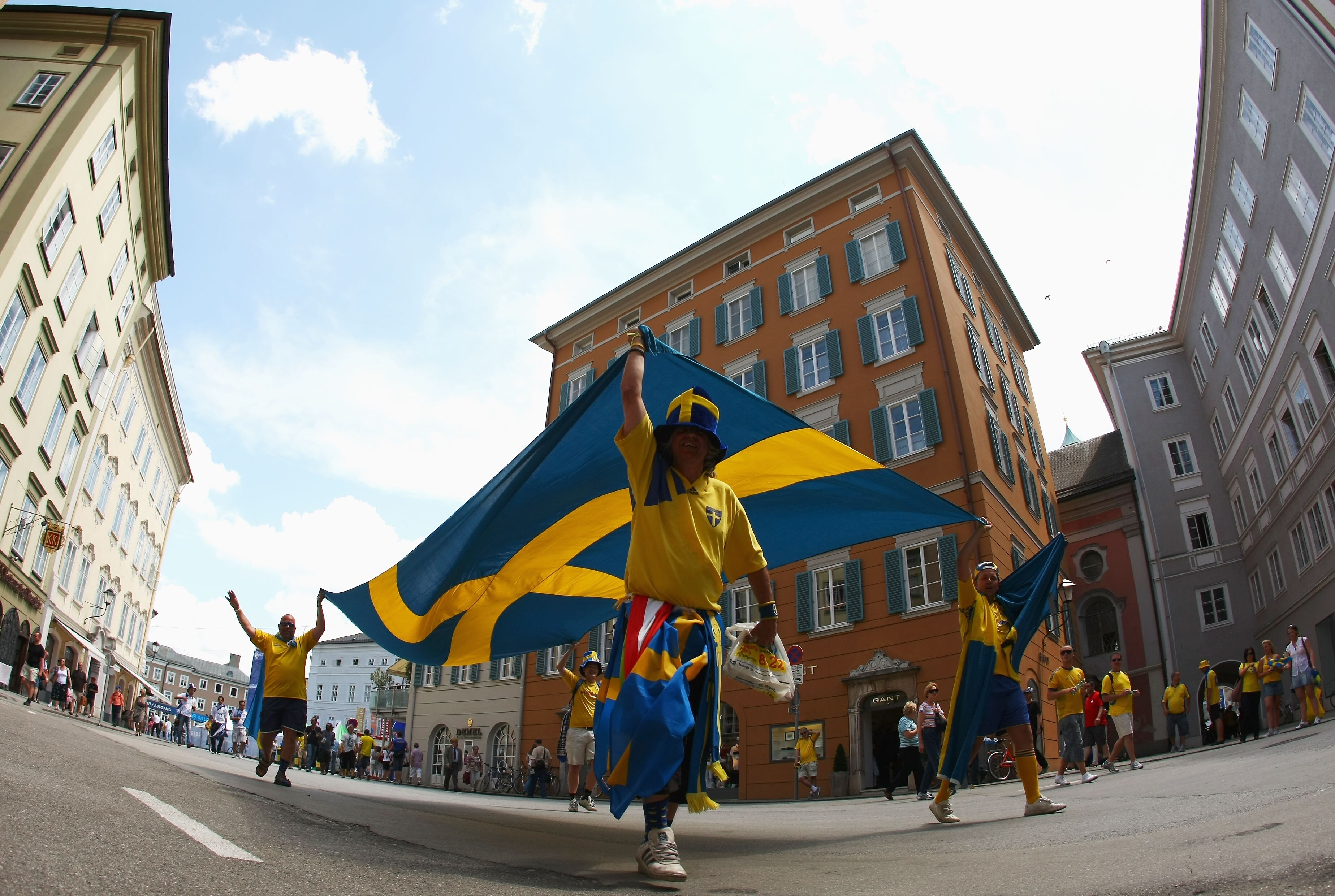 SALZBURG, AUSTRIA - JUNE 10:  Swedish fans carrying a flag enjoy the atmosphere in the city ahead of the UEFA EURO 2008 Group D match between Greece and Sweden at Stadion Wals-Siezenheim on June 10, 2008 in Salzburg, Austria.  (Photo by Jamie McDonald/Get