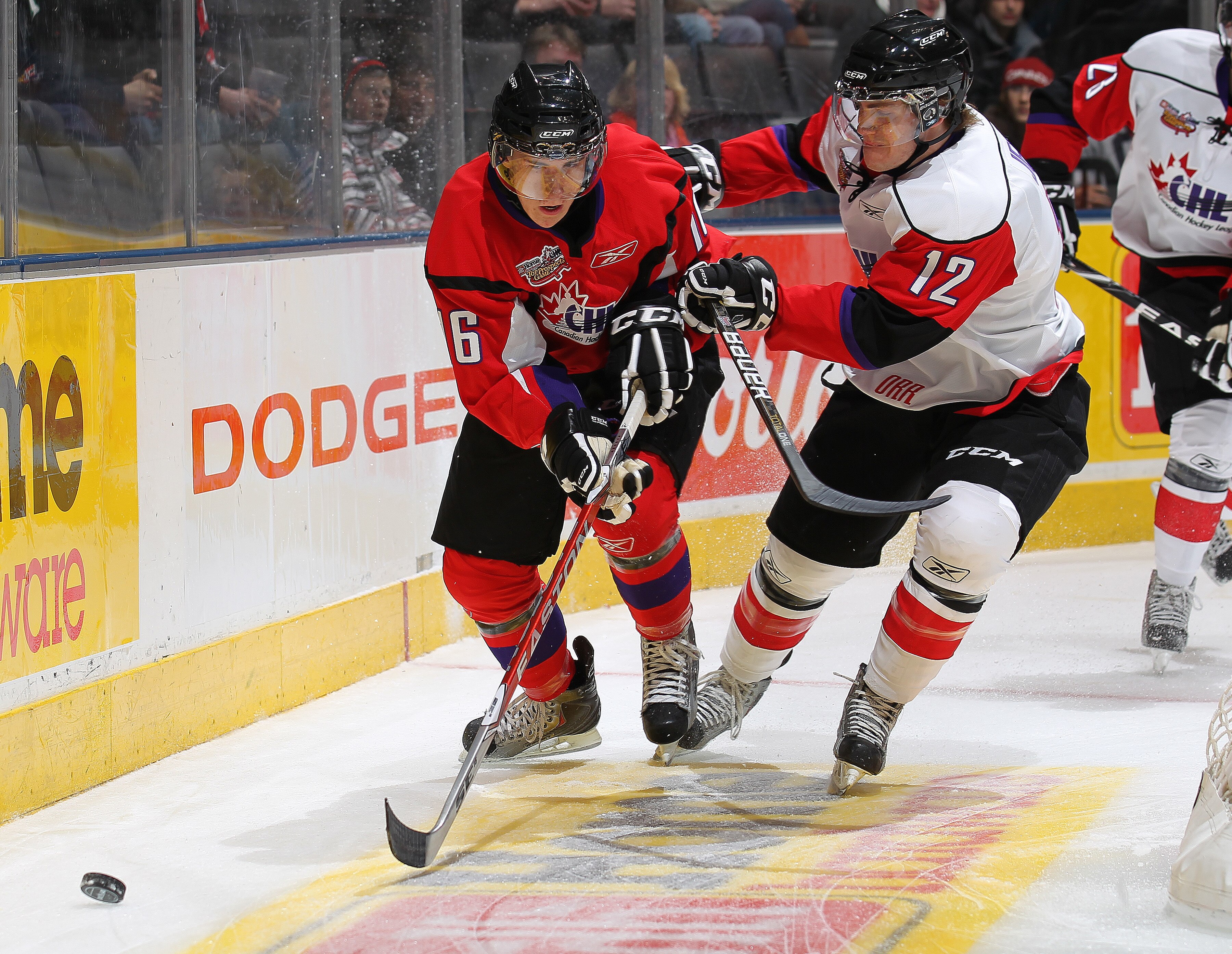 TORONTO, CANADA - JANUARY 19:  Ryan Strome #16 of Team Cherry tries to elude the check of Boone Jenner #12 of Team Orr in the 2011 Home Hardware CHL/NHL Prospects game on January 19, 2011 at the Air Canada Centre in Toronto, Canada. (Photo by Claus Anders