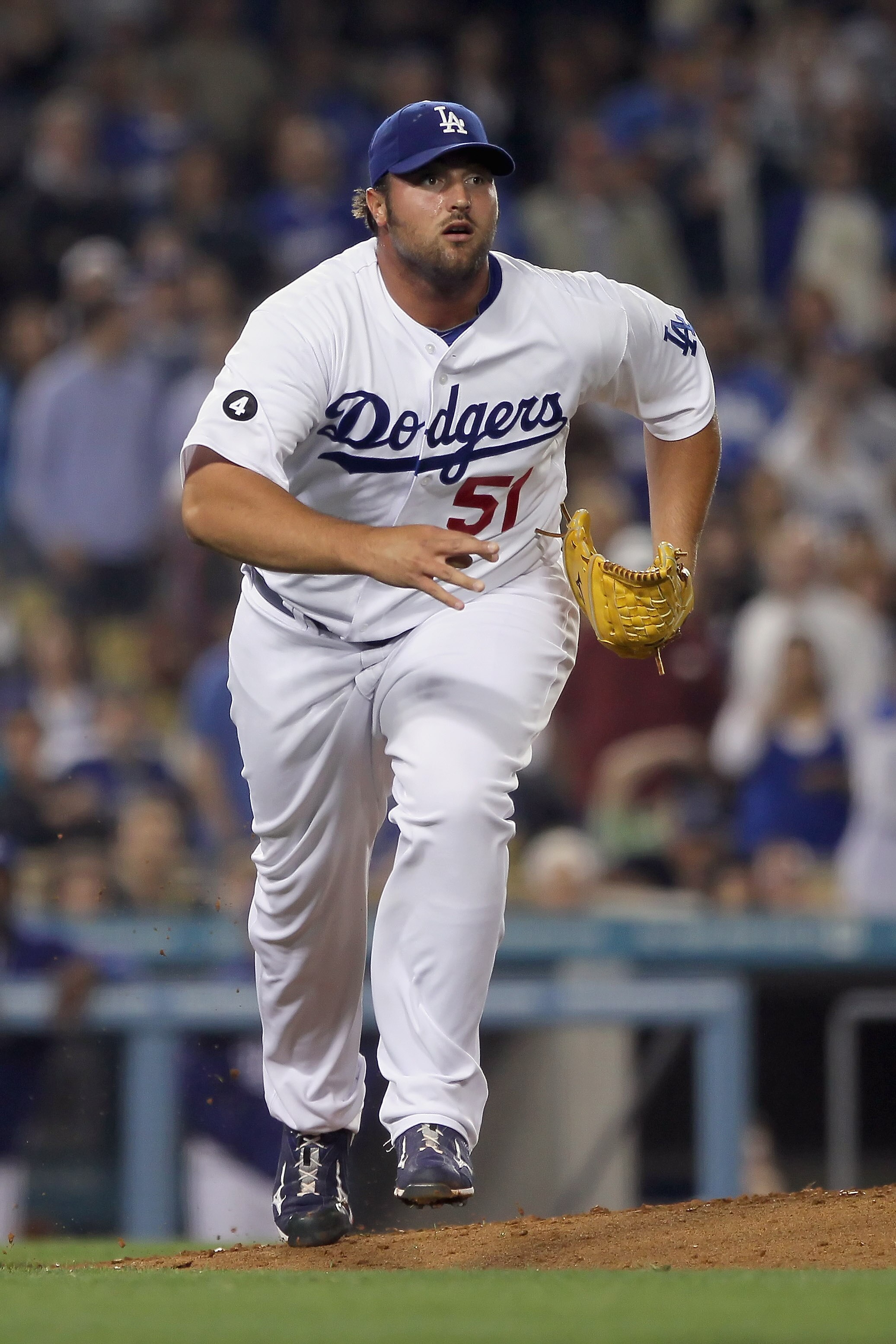 LOS ANGELES, CA - APRIL 01:  Jonathan Broxton #51 of the Los Angeles Dodgers runs to cover first base against the San Francisco Giants at Dodger Stadium on April 1, 2011 in Los Angeles, California.  (Photo by Jeff Gross/Getty Images)