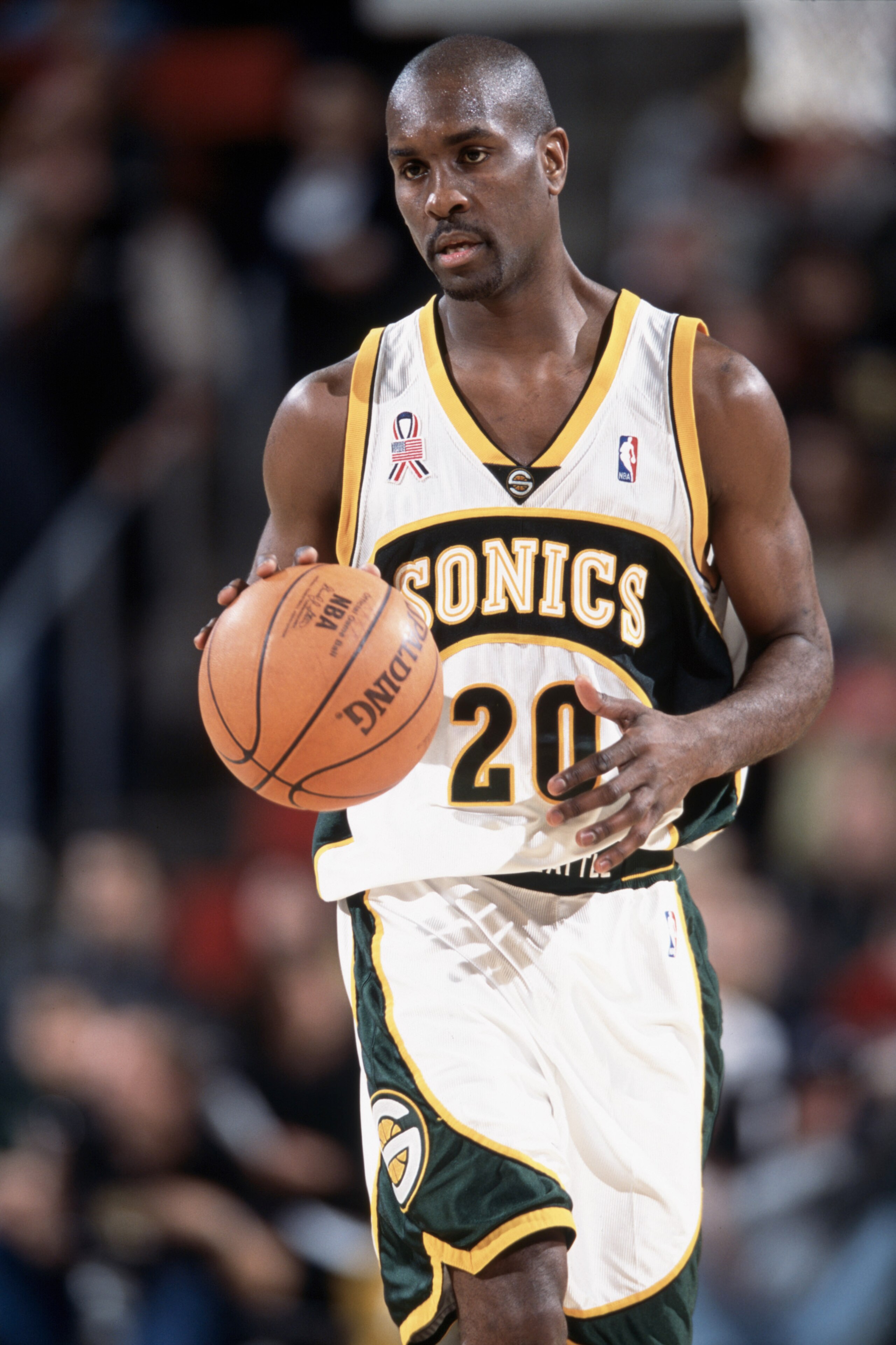 13 Nov 2001:  Point guard Gary Payton #20 of the Seattle SuperSonics dribbles the ball during the NBA game against the Phoenix Suns at Key Arena in Seattle, Washington.  The Suns edged the SuperSonics 92-91.  Mandatory Credit: Otto Greule/Getty Images