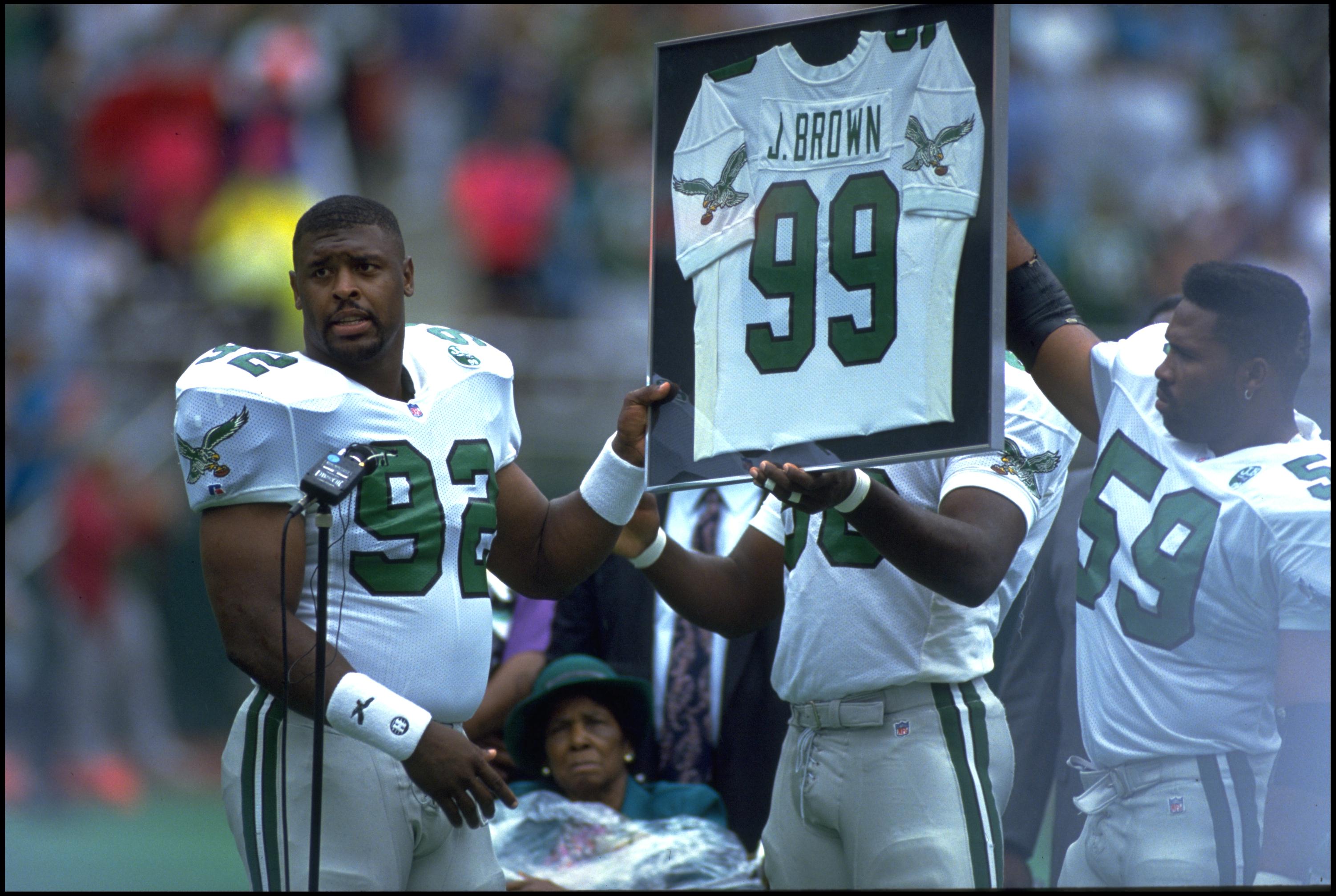 6 SEP 1992:  PHILADELPHIA EAGLES DEFENSIVE LINEMAN REGGIE WHITE #92 ALONG WITH LINEBACKER SETH JOYNER #59, HOLD UP FORMER EAGLES LINEMAN JEROME BROWN #99 RETIRED JERSEY PRIOR TO THE EAGLES 15-13 WIN OVER THE NEW ORLEANS SAINTS AT VETERANS STADIUM IN PHILA