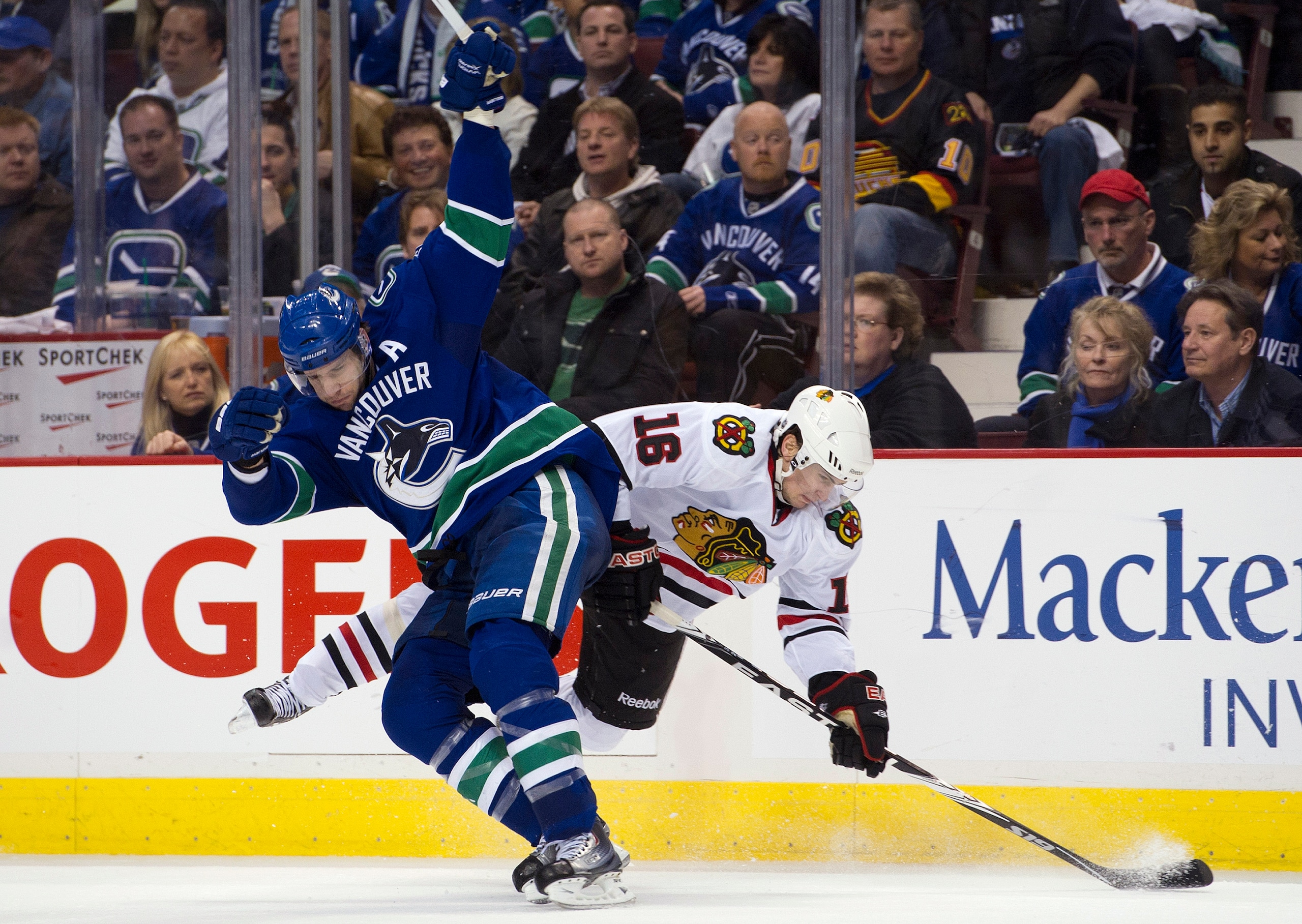 VANCOUVER, CANADA - APRIL 15: Ryan Kesler #17 of the Vancouver Canucks and Marcus Kruger #16 of the Chicago Blackhawks collide during the third period in Game Two of the Western Conference Quarterfinals during the 2011 NHL Stanley Cup Playoffs on April 15 VANCOUVER, CANADA - APRIL 15: Ryan Kesler #17 of the Vancouver Canucks and Marcus Kruger #16 of the Chicago Blackhawks collide during the third period in Game Two of the Western Conference Quarterfinals during the 2011 NHL Stanley Cup Playoffs on April 15