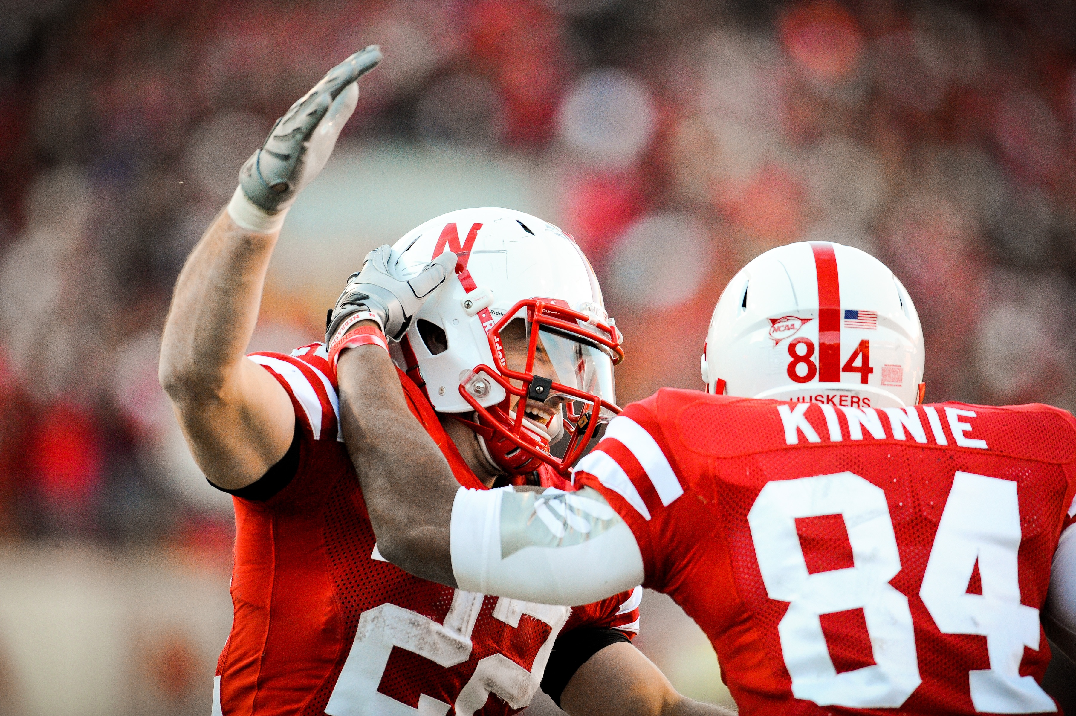 LINCOLN, NE - NOVEMBER 26: Rex Burkhead #22 of the Nebraska Cornhuskers celebrates his touchdown pass with Brandon Kinnie #84   during their game at Memorial Stadium on November 26, 2010 in Lincoln, Nebraska. Nebraska defeated Colorado 45-17 (Photo by Eri