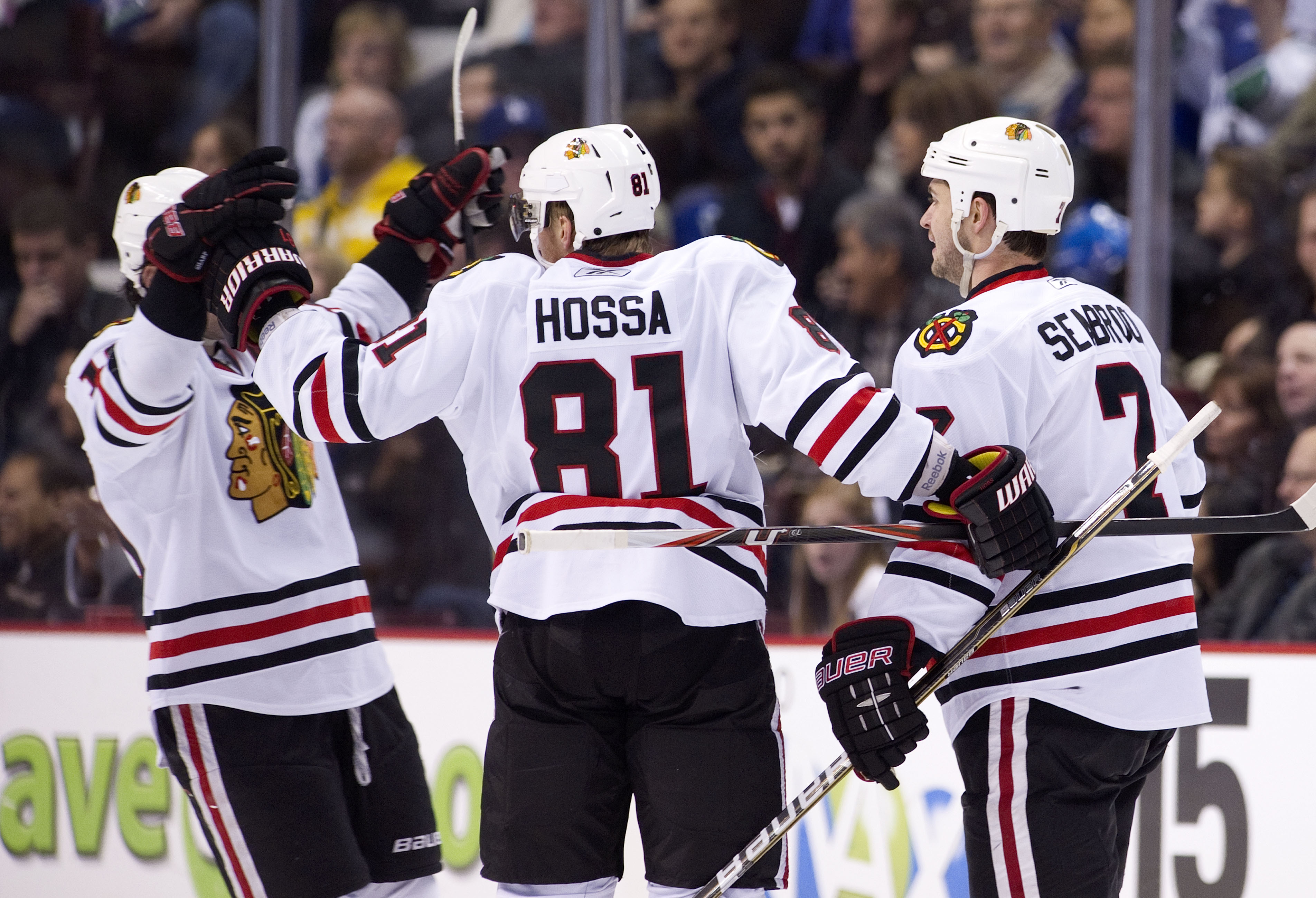 VANCOUVER, CANADA - NOVEMBER 20: Brent Seabrook #7 of the Chicago Blackhawks celebrates with teammates Marian Hossa #81 and Patrick Sharp #10 after scoring against the Vancouver Canucks during the second period in NHL action on November 20, 2010 at Rogers