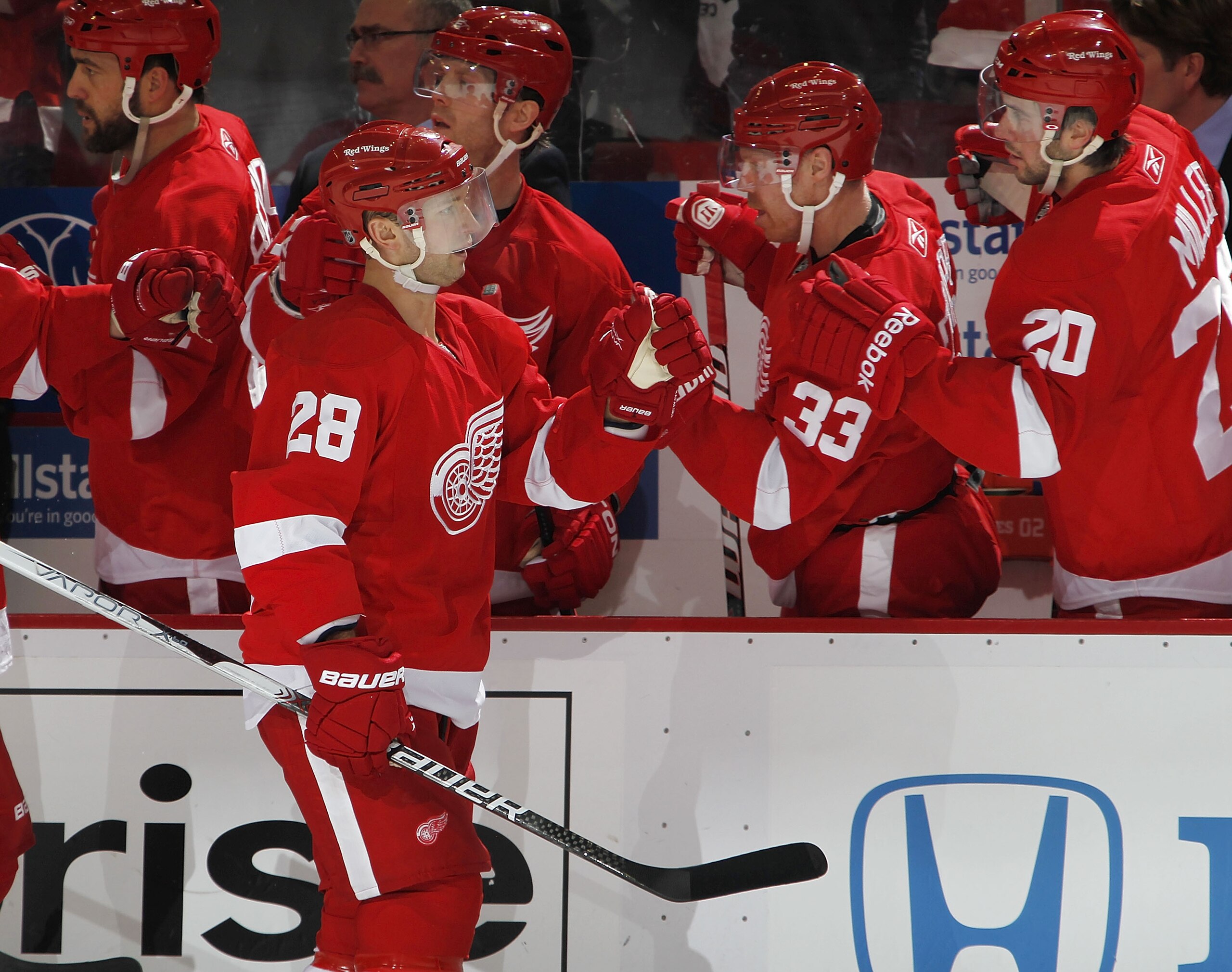 DETROIT, MI - APRIL 16:  Brian Rafalski #28 of the Detroit Red Wings celebrates a first-period goal with the bench while playing the Phoenix Coyotes in Game Two of the Western Conference Quarterfinals during the 2011 Stanley Cup Playoffs at Joe Louis Aren