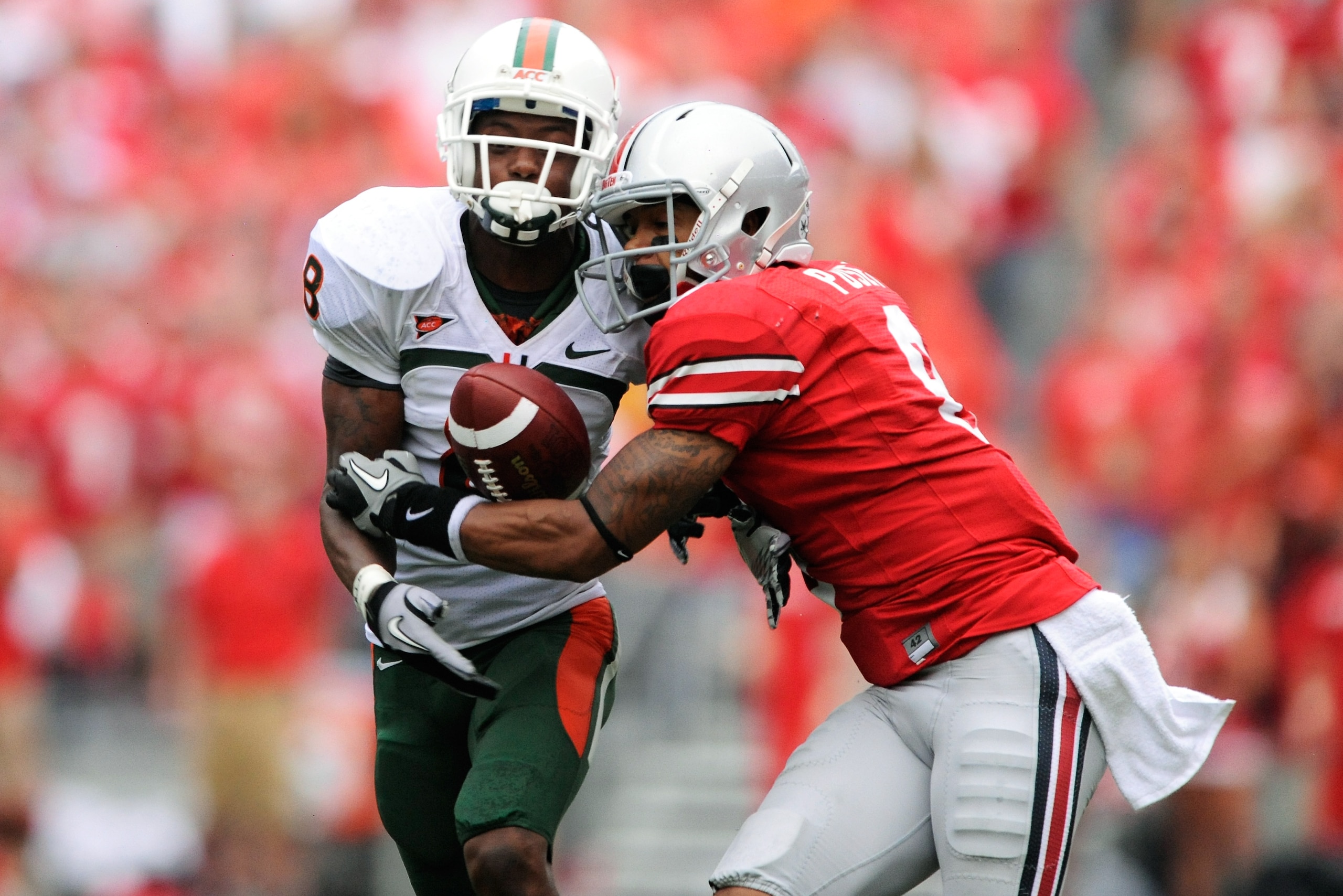 COLUMBUS, OH - SEPTEMBER 11: DeVier Posey #8 of the Ohio State Buckeyes battles with DeMarcus Van Dyke #8 for possession of a pass at Ohio Stadium on September 11, 2010 in Columbus, Ohio. The pass was incomplete. (Photo by Jamie Sabau/Getty Images) COLUMBUS, OH - SEPTEMBER 11: DeVier Posey #8 of the Ohio State Buckeyes battles with DeMarcus Van Dyke #8 for possession of a pass at Ohio Stadium on September 11, 2010 in Columbus, Ohio. The pass was incomplete. (Photo by Jamie Sabau/Getty Images)