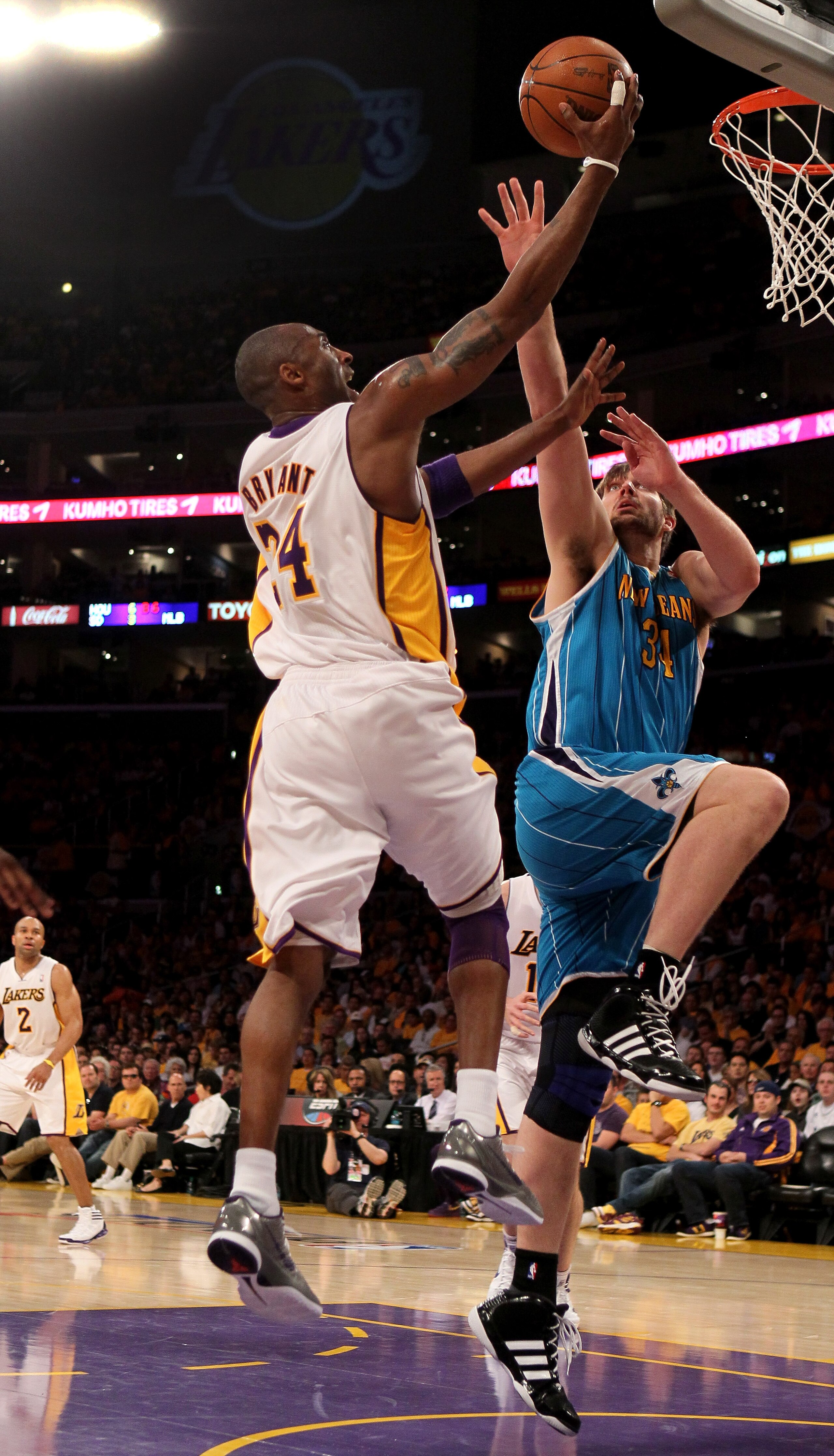 LOS ANGELES, CA - APRIL 17:  Kobe Bryant #24 of the Los Angeles Lakers shoots over Aaron Gray #34 of the New Orleans Hornets in Game One of the Western Conference Quarterfinals in the 2011 NBA Playoffs on April 17, 2011 at Staples Center in Los Angeles, C