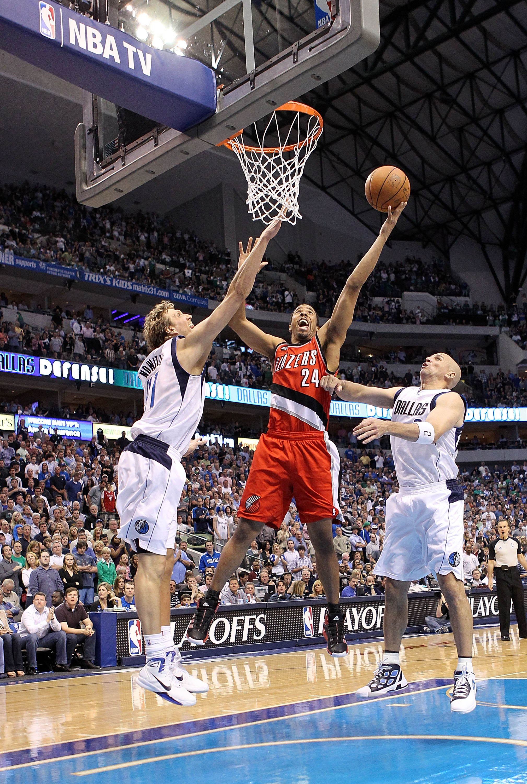 DALLAS, TX - APRIL 16: Guard Andre Miller #24 of the Portland Trail Blazers takes a shot against Dirk Nowitzki #41 and Jason Kidd #2 of the Dallas Mavericks in Game One of the Western Conference Quarterfinals during the 2011 NBA Playoffs on April 16, 2011