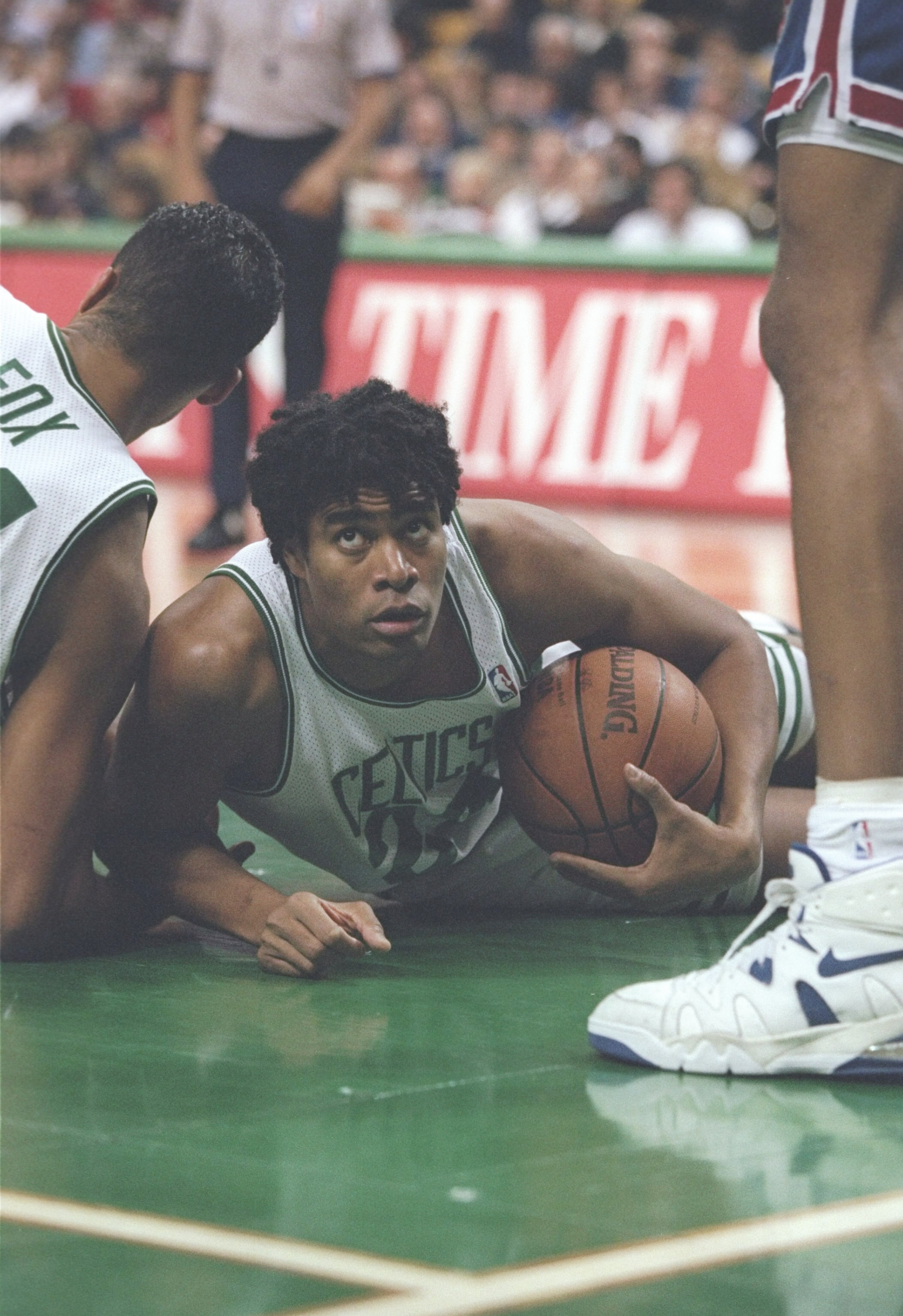 1 Dec 1995:  Center Pervis Ellison of the Boston Celtics lays on the court during a game against the New Jersey Nets at the Fleet Center in Boston, Massachusetts.  The Nets won the game 131-123. Mandatory Credit: Allsport  /Allsport
