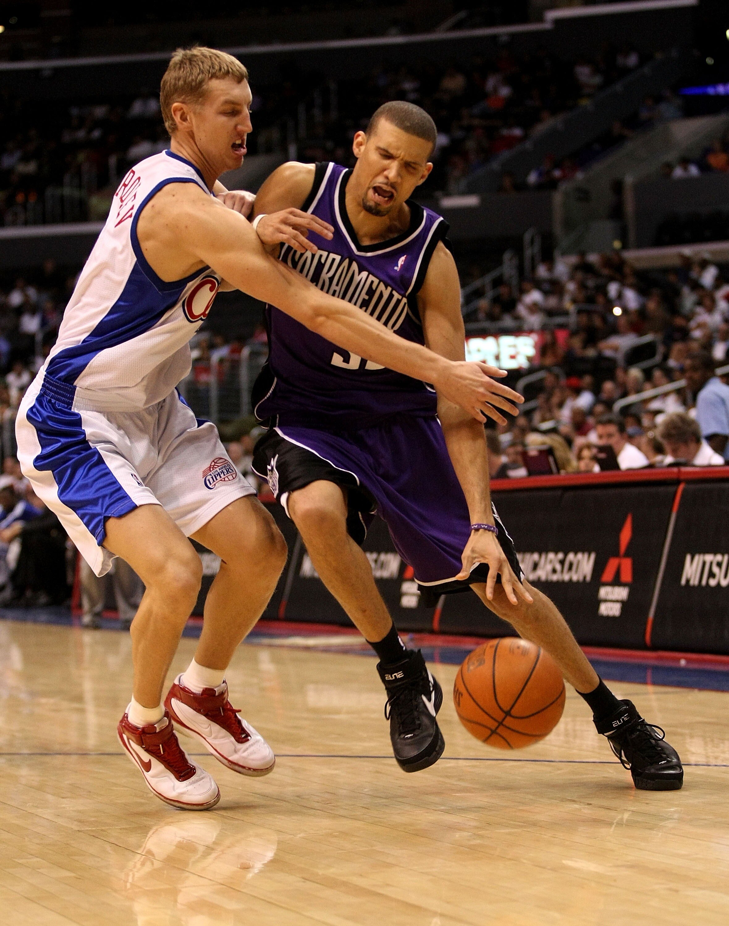LOS ANGELES - OCTOBER 24: Francsico Garcia #32 of the Sacramento Kings draws a foul from Yaroslav Korolev #8 of the Los Angeles Clippers on October 24, 2007 at Stpales Center in Los Angeles, California.  (Photo by Stephen Dunn/Getty Images)
