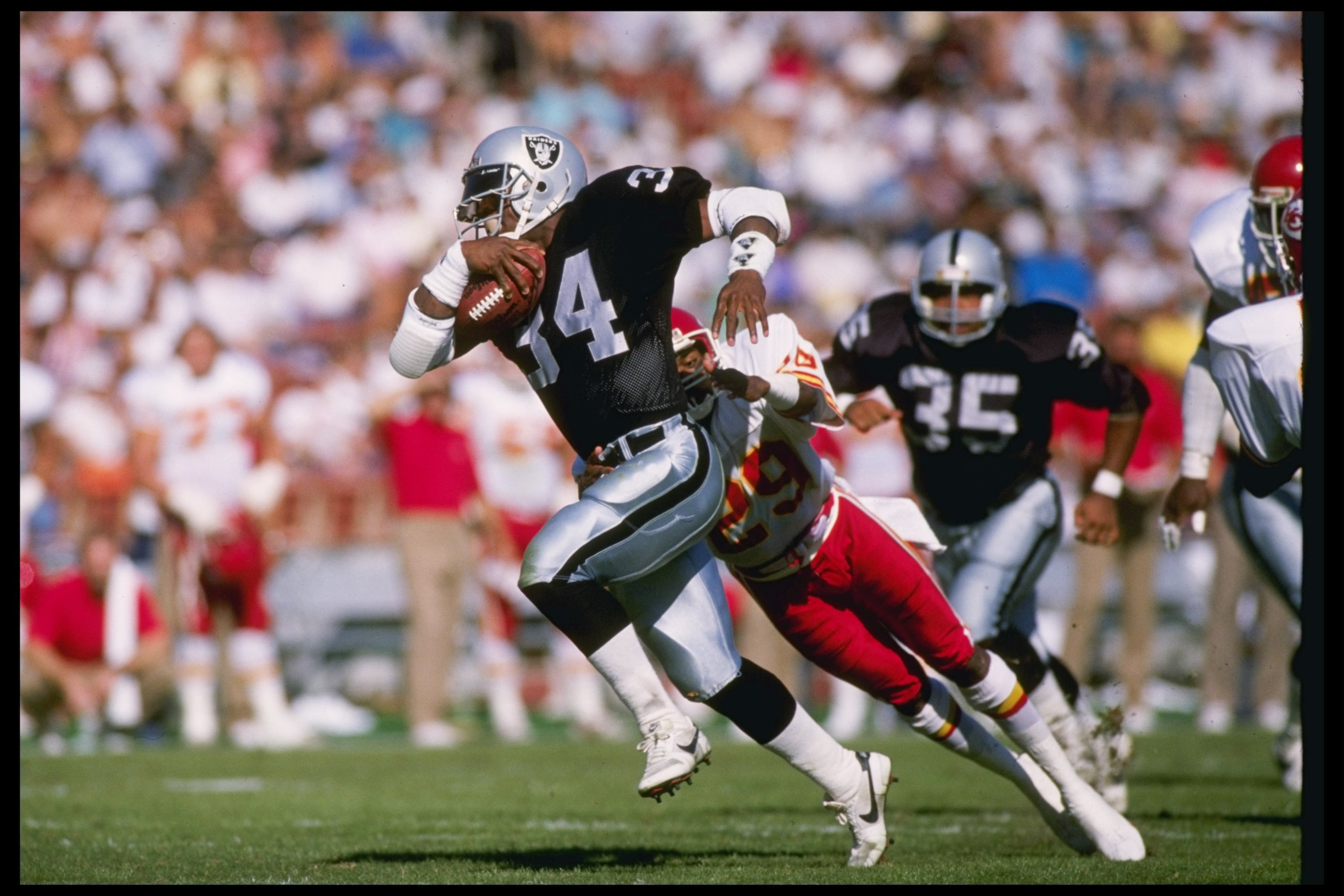 30 Oct 1988: Running back Bo Jackson of the Los Angeles Raiders moves the ball during a game against the Kansas City Chiefs at the Los Angeles Memorial Coliseum in Los Angeles, California. The Raiders won the game, 17-10.