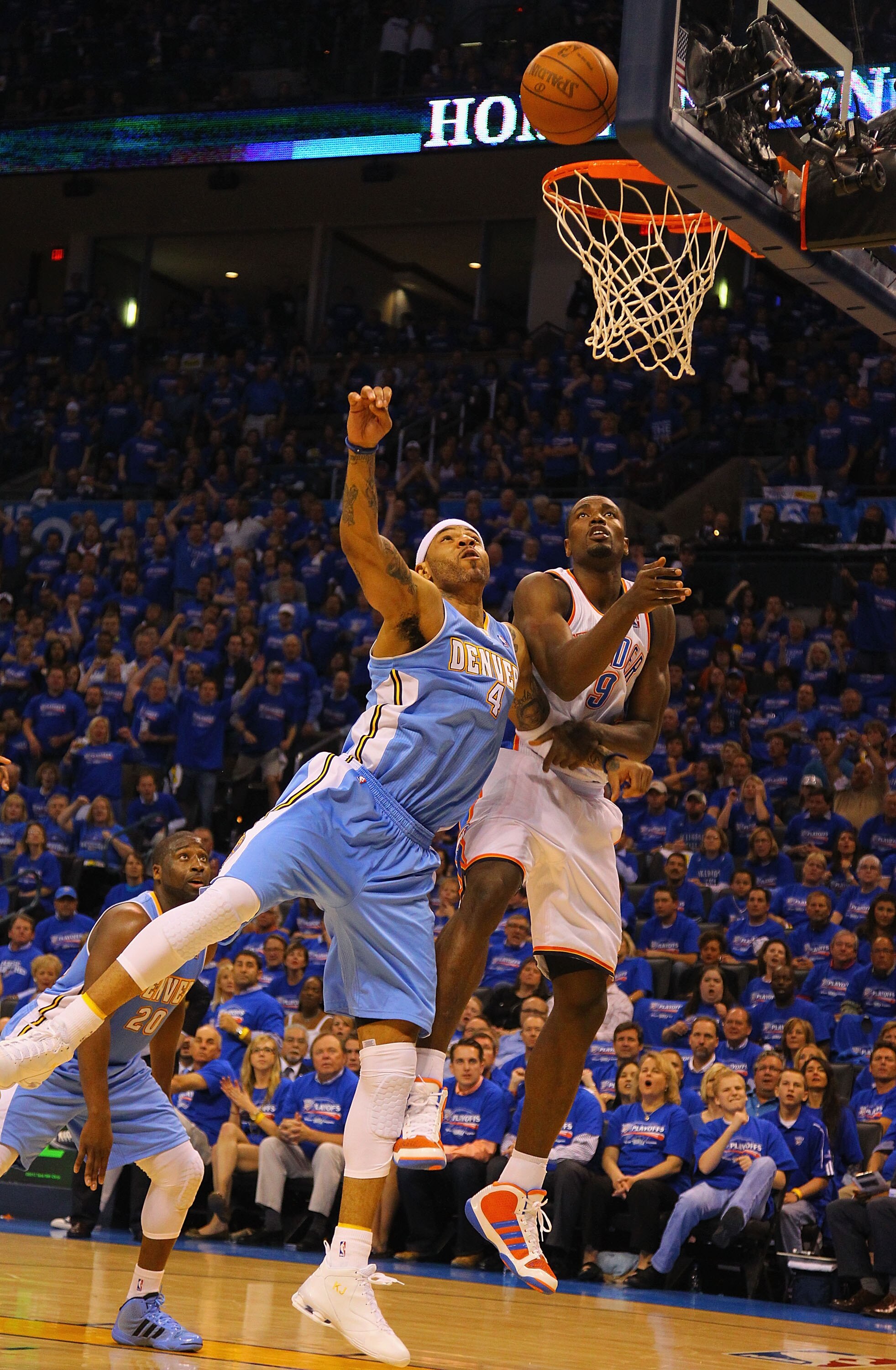OKLAHOMA CITY, OK - APRIL 17: Kenyon Martin #4 of the Denver Nuggets and Serge Ibaka #9 of the Oklahoma City Thunder battle for a rebound in Game One of the Western Conference Quarterfinals in the 2011 NBA Playoffs on April 17, 2011 at the Ford Center in