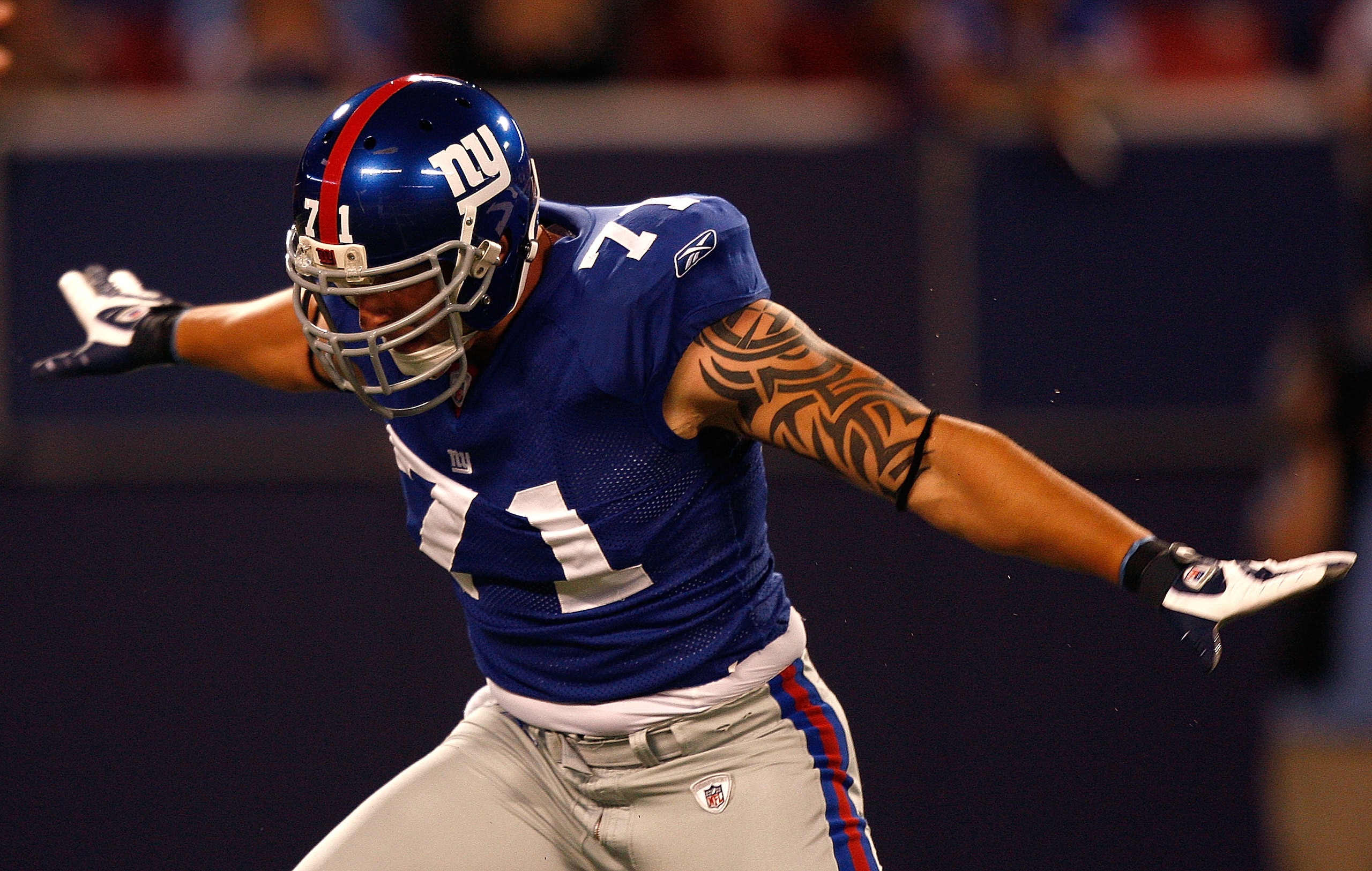 EAST RUTHERFORD, NJ - AUGUST 28:  Dave Tollefson #71 of the New York Giants reacts after making a sack during a preseason game against the New England Patriots on August 28, 2008 at Giants Stadium in East Rutherford, New Jersey.  (Photo by Mike Ehrmann/Ge