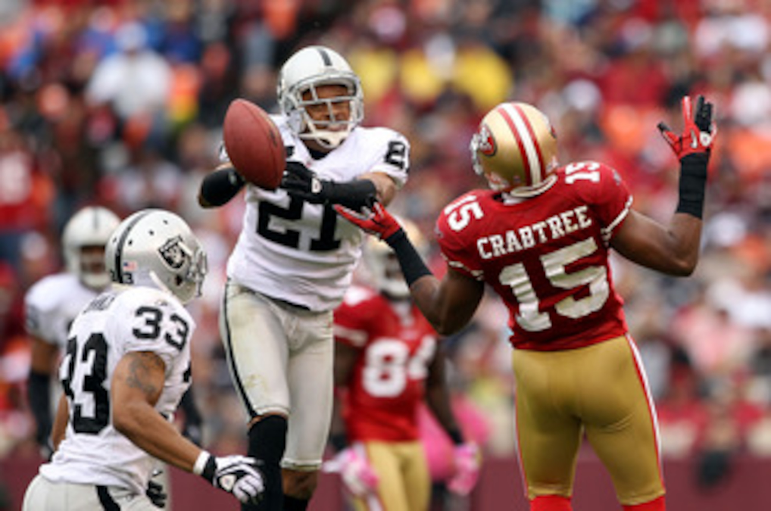 SAN FRANCISCO - OCTOBER 17:  Nnamdi Asomugha  #21 of the Oakland Raiders breaks up a pass intended for Michael Crabtree #15 of the San Francisco 49ers at Candlestick Park on October 17, 2010 in San Francisco, California.  (Photo by Ezra Shaw/Getty Images)