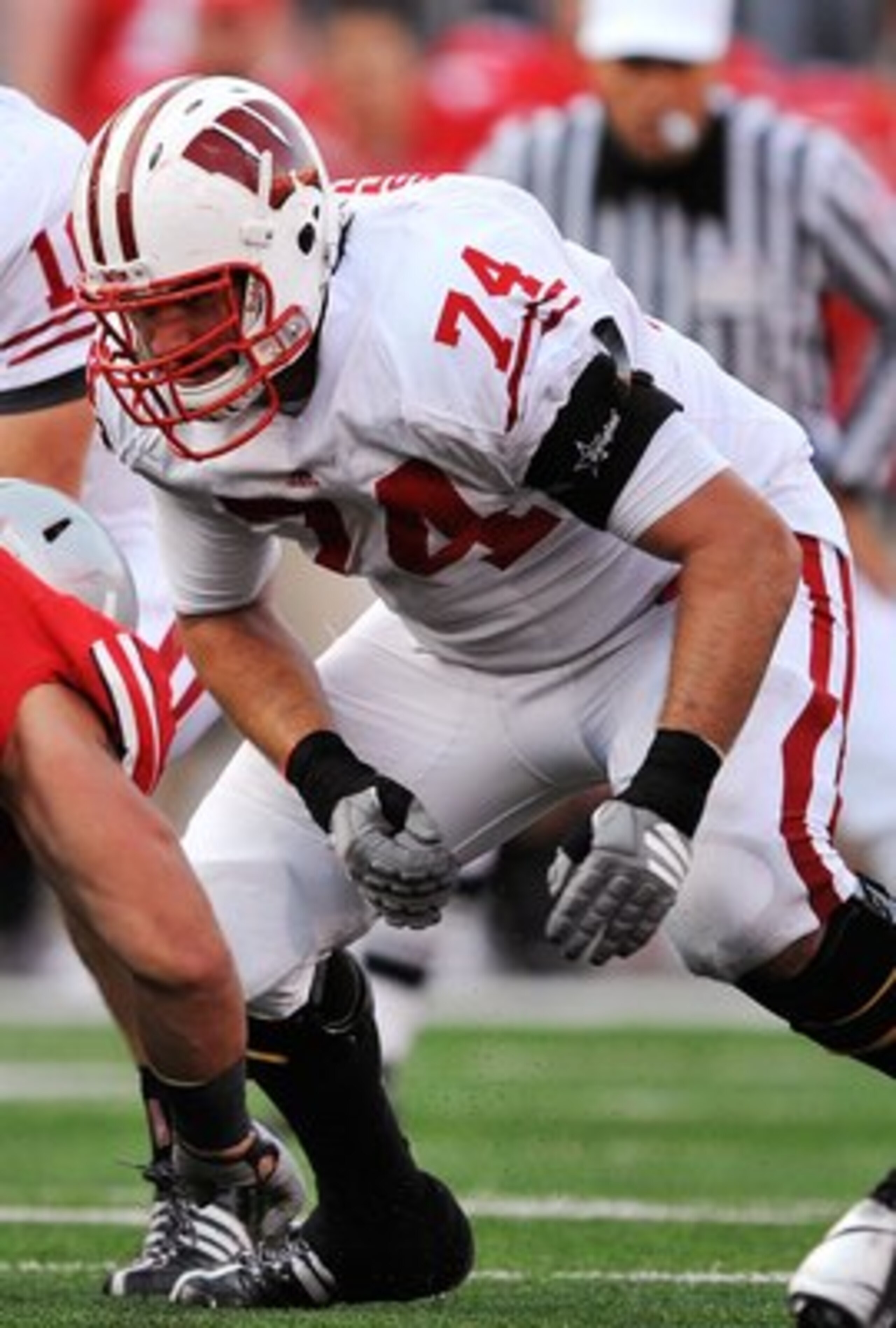 COLUMBUS, OH - OCTOBER 10:  Offensive lineman John Moffitt #74 of the Wisconsin Badgers blocks against the Ohio State Buckeyes at Ohio Stadium on October 10, 2009 in Columbus, Ohio.  (Photo by Jamie Sabau/Getty Images)