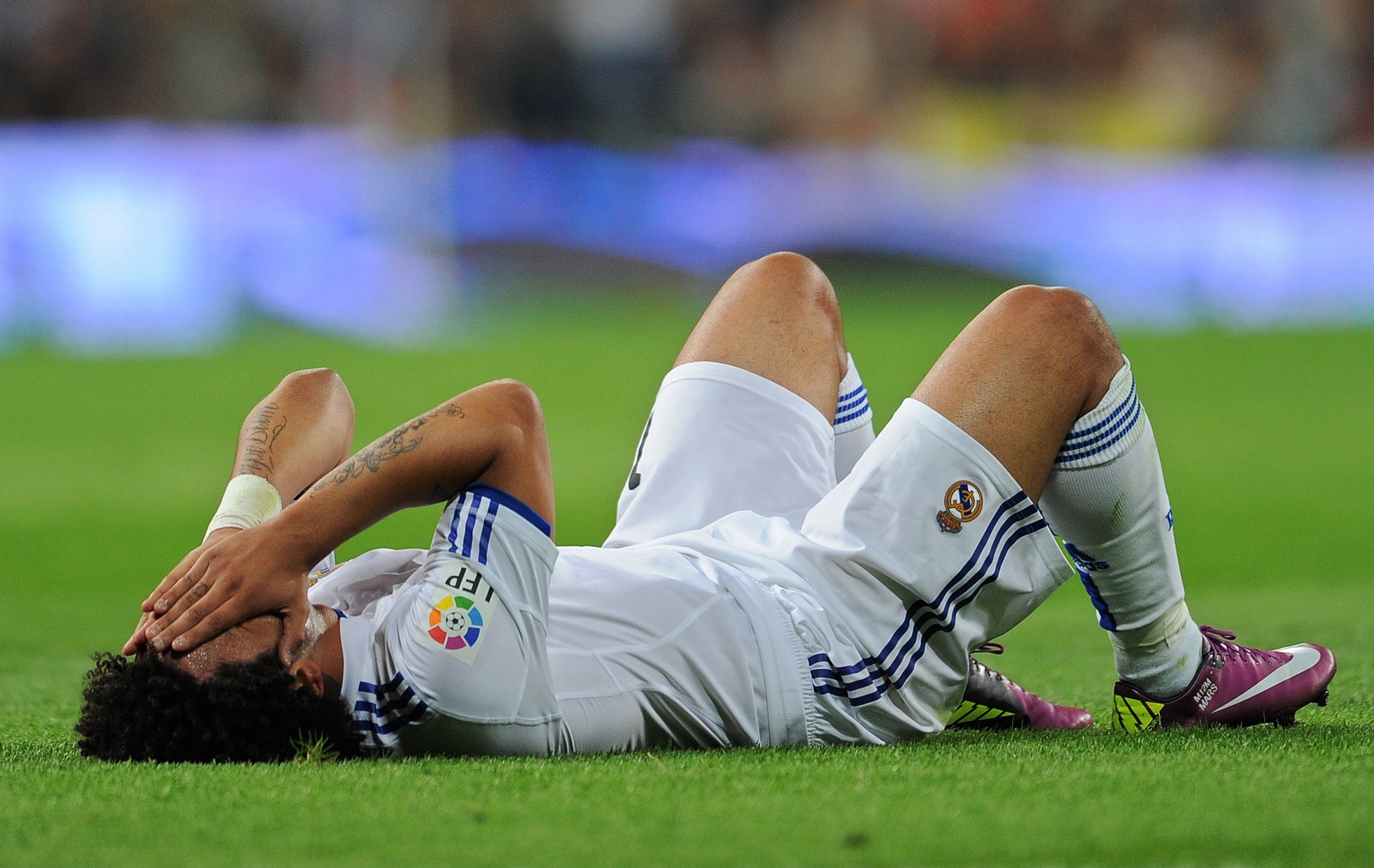 MADRID, SPAIN - APRIL 16:  Marcelo of Real Madrid reacts during the la Liga match between Real Madrid and Barcelona at Estadio Santiago Bernabeu on April 16, 2011 in Madrid, Spain.  (Photo by Jasper Juinen/Getty Images)