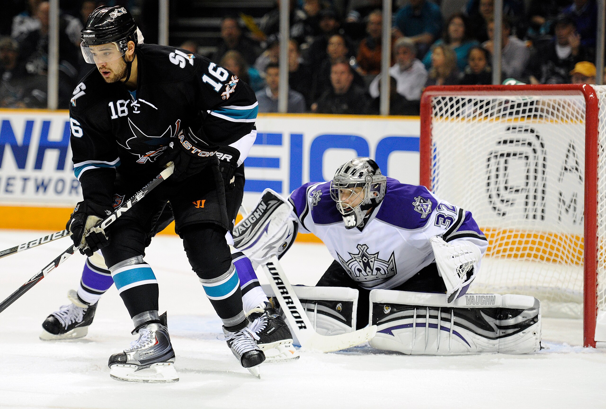 SAN JOSE, CA - APRIL 16: Jonathan Quick #32 of the Los Angeles Kings tries to keep his eye on the puck behind Devin Setoguchi #16 of the San Jose Sharks in Game Two of the Western Conference Quarterfinals during the 2011 NHL Stanley Cup Playoffs at the HP SAN JOSE, CA - APRIL 16: Jonathan Quick #32 of the Los Angeles Kings tries to keep his eye on the puck behind Devin Setoguchi #16 of the San Jose Sharks in Game Two of the Western Conference Quarterfinals during the 2011 NHL Stanley Cup Playoffs at the HP