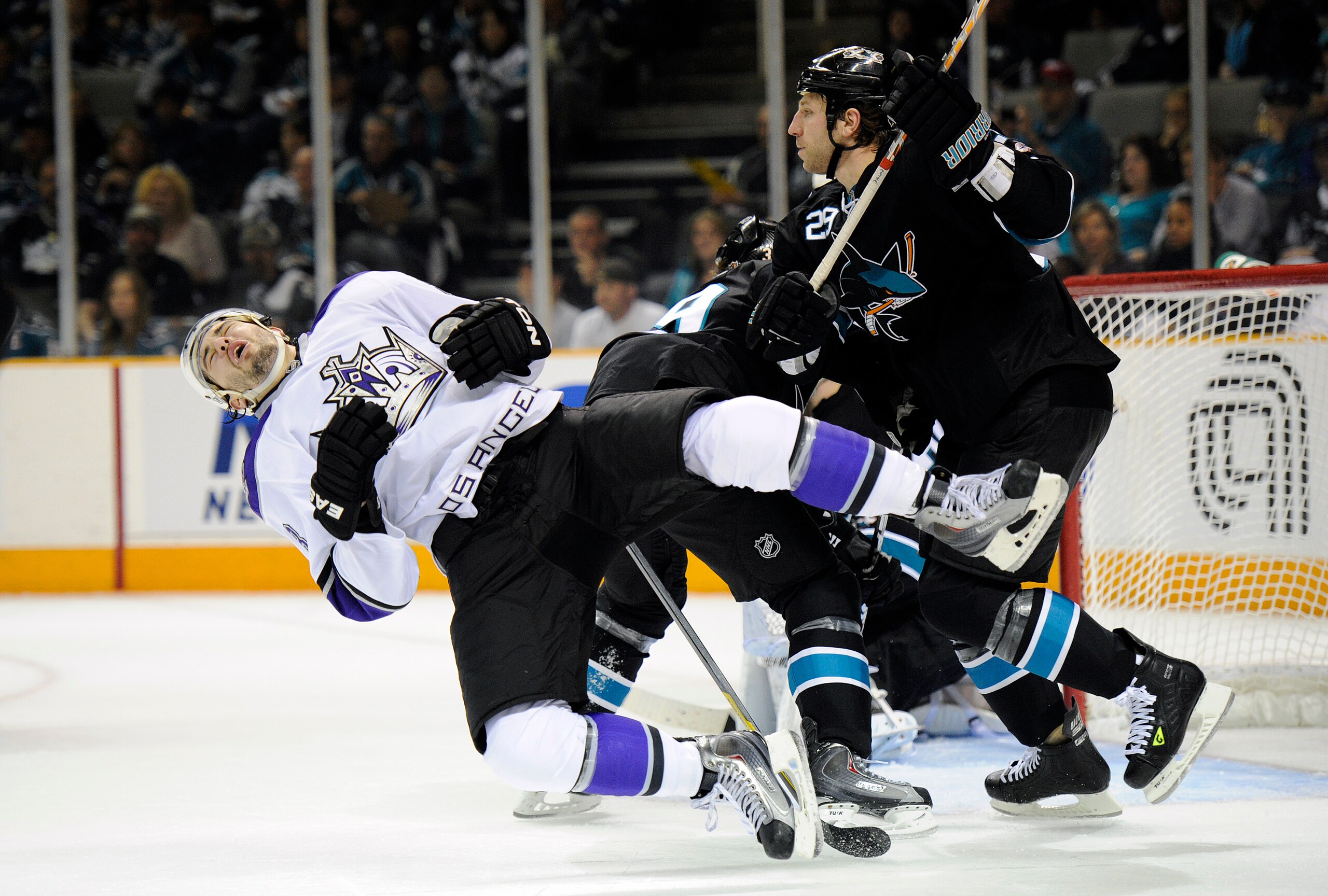 SAN JOSE, CA - APRIL 16: Ryane Clowe #29 the San Jose Sharks gets a penalty for cross checking Drew Doughty #8 of the Los Angeles Kings in Game Two of the Western Conference Quarterfinals during the 2011 NHL Stanley Cup Playoffs at the HP Pavilion on Apri SAN JOSE, CA - APRIL 16: Ryane Clowe #29 the San Jose Sharks gets a penalty for cross checking Drew Doughty #8 of the Los Angeles Kings in Game Two of the Western Conference Quarterfinals during the 2011 NHL Stanley Cup Playoffs at the HP Pavilion on Apri