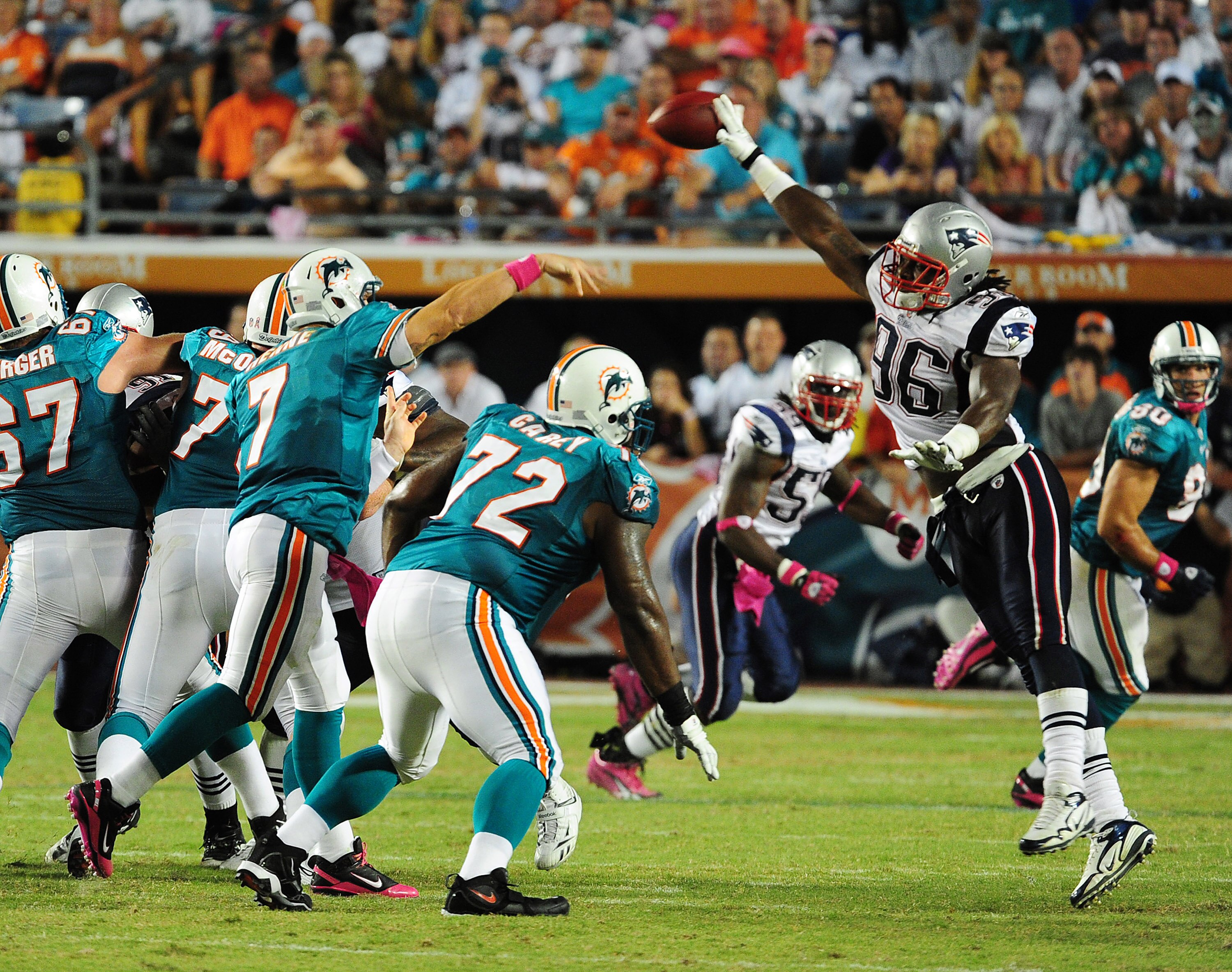 MIAMI - OCTOBER 4: Chad Henne #7 of the Miami Dolphins has his pass batted down by Jermaine Cunningham #96 of the New England Patriots at Sun Life Field on October 4, 2010 in Miami, Florida. (Photo by Scott Cunningham/Getty Images)