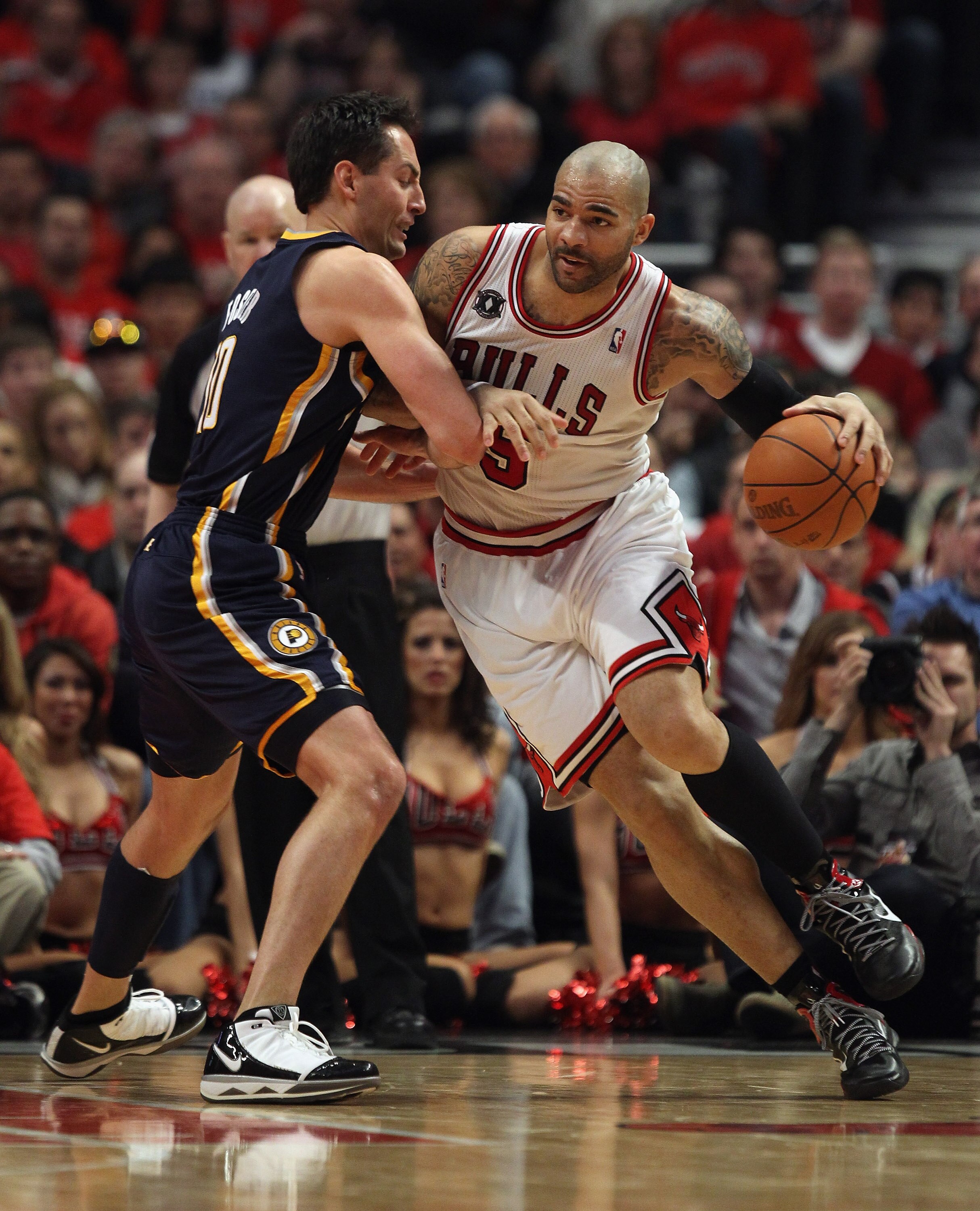 CHICAGO, IL - APRIL 16: Carlos Boozer #5 of the Chicago Bulls moves against Jeff Foster #10 of the Indiana Pacers in Game One of the Eastern Conference Quarterfinals in the 2011 NBA Playoffs at the United Center on April 16, 2011 in Chicago, Illinois. The