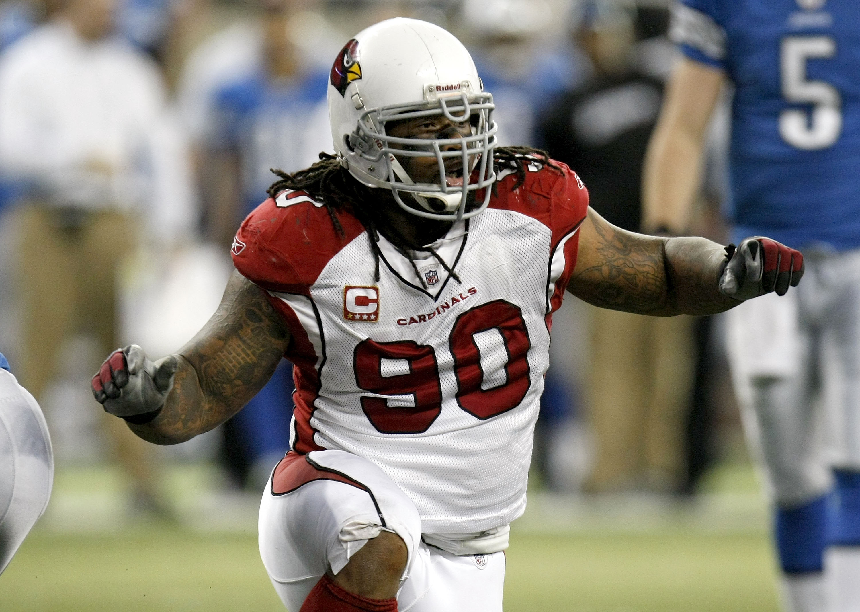 DETROIT - DECEMBER 20:  Darnell Dockett #90 of the Arizona Cardinals reacts after making a fourth down stop to take over on downs while playing the Detroit Lions on December 20, 2009 at Ford Field in Detroit, Michigan. Arizona won the game 31-24.  (Photo