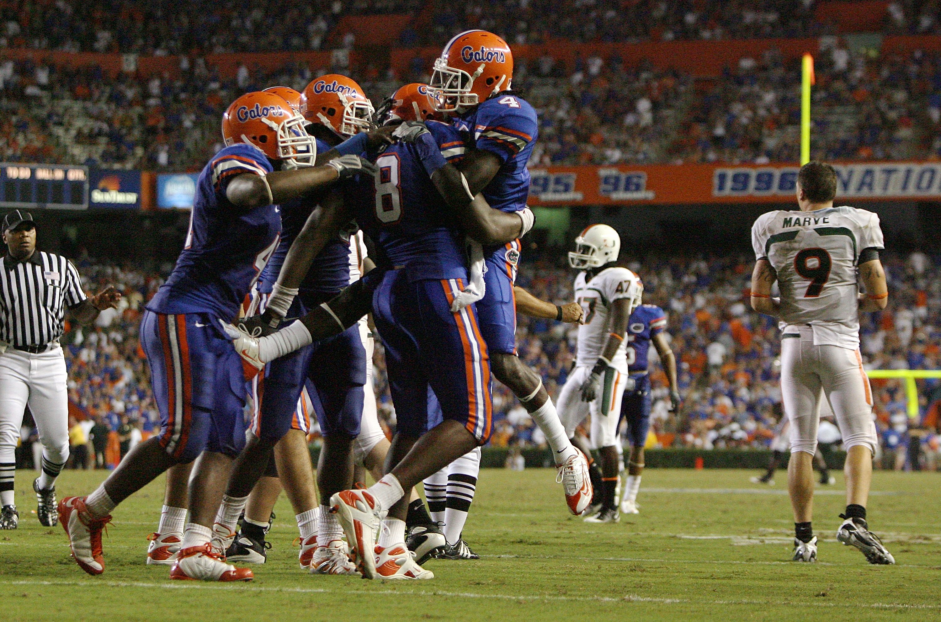 GAINESVILLE, FL - SEPTEMBER 06:  Defensive end Carlos Dunlap #8 of the Florida Gators is congratulated by teammates after sacking quarterback Robert Marve #9 of the Miami Hurricanes at Ben Hill Griffin Stadium on September 6, 2008 in Gainesville, Florida.