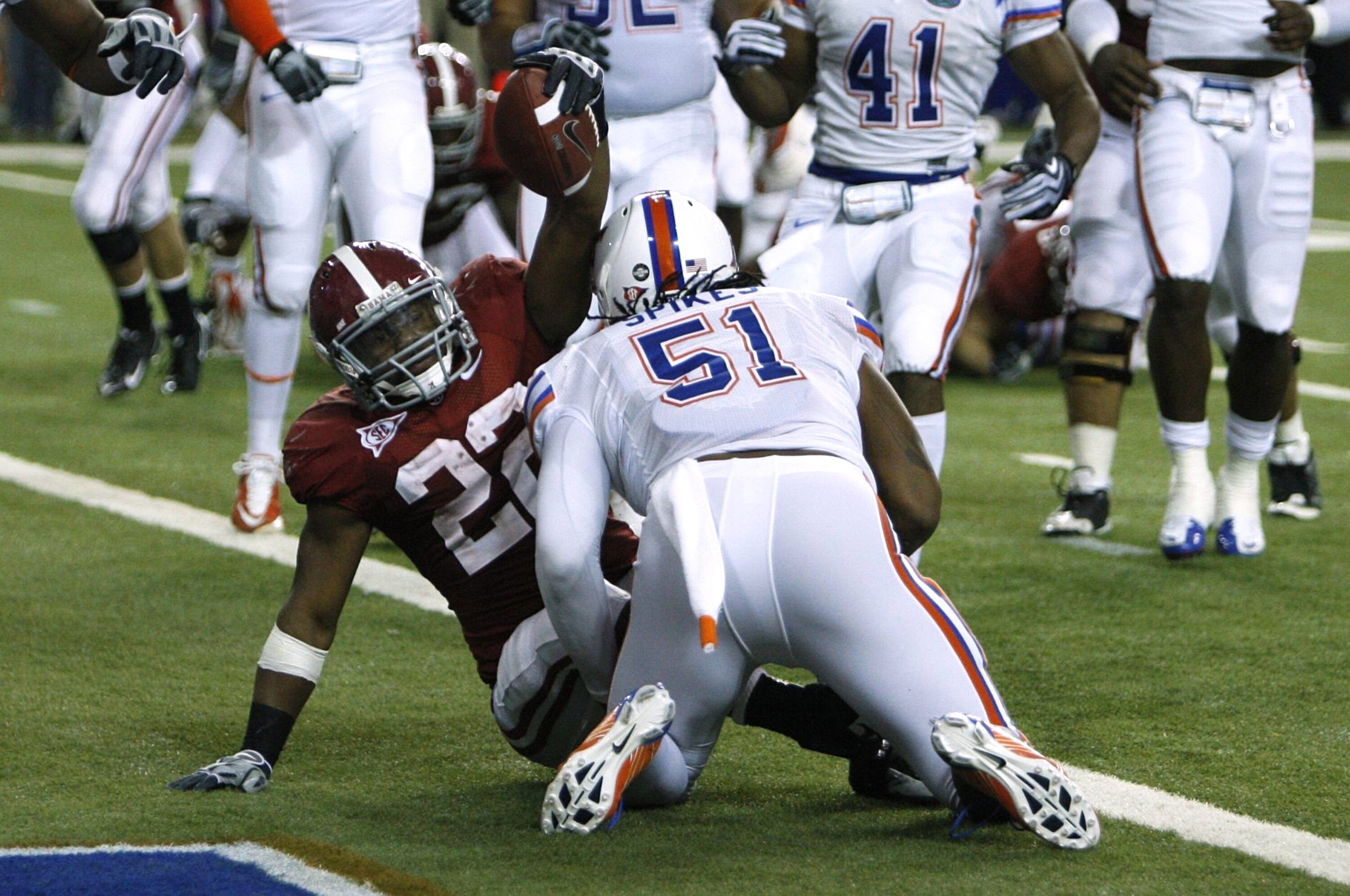 ATLANTA - DECEMBER 5:  Mark Ingram #22 of the Alabama Crimson Tide celebrates after he scored a 3-yard rushing touchdown against Brandon Spikes #51 of the Florida Gators during the SEC Championship game at Georgia Dome on December 5, 2009 in Atlanta, Geor