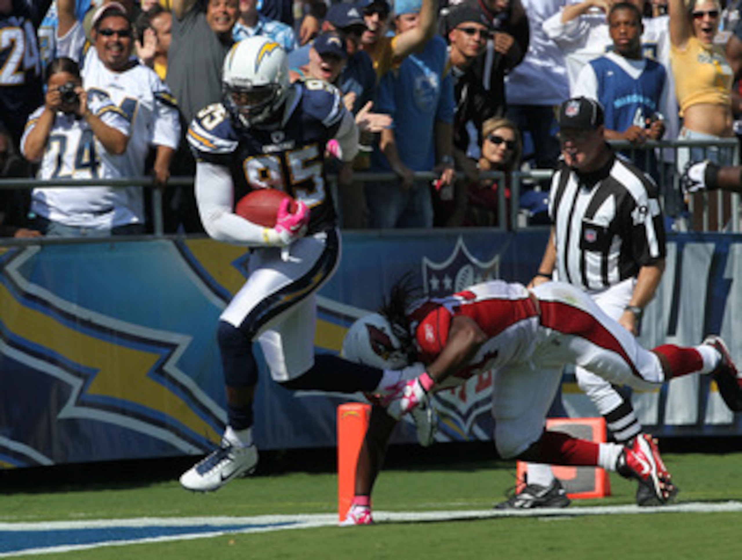 SAN DIEGO - OCTOBER 03:  Linebacker Shaun Phillips #95 of the San Diego Chargers crosses the goal line as he returns an interception for a 31 yard touchdown in the second quarter against the Arizona Cardinals at Qualcomm Stadium on October 3, 2010 in San