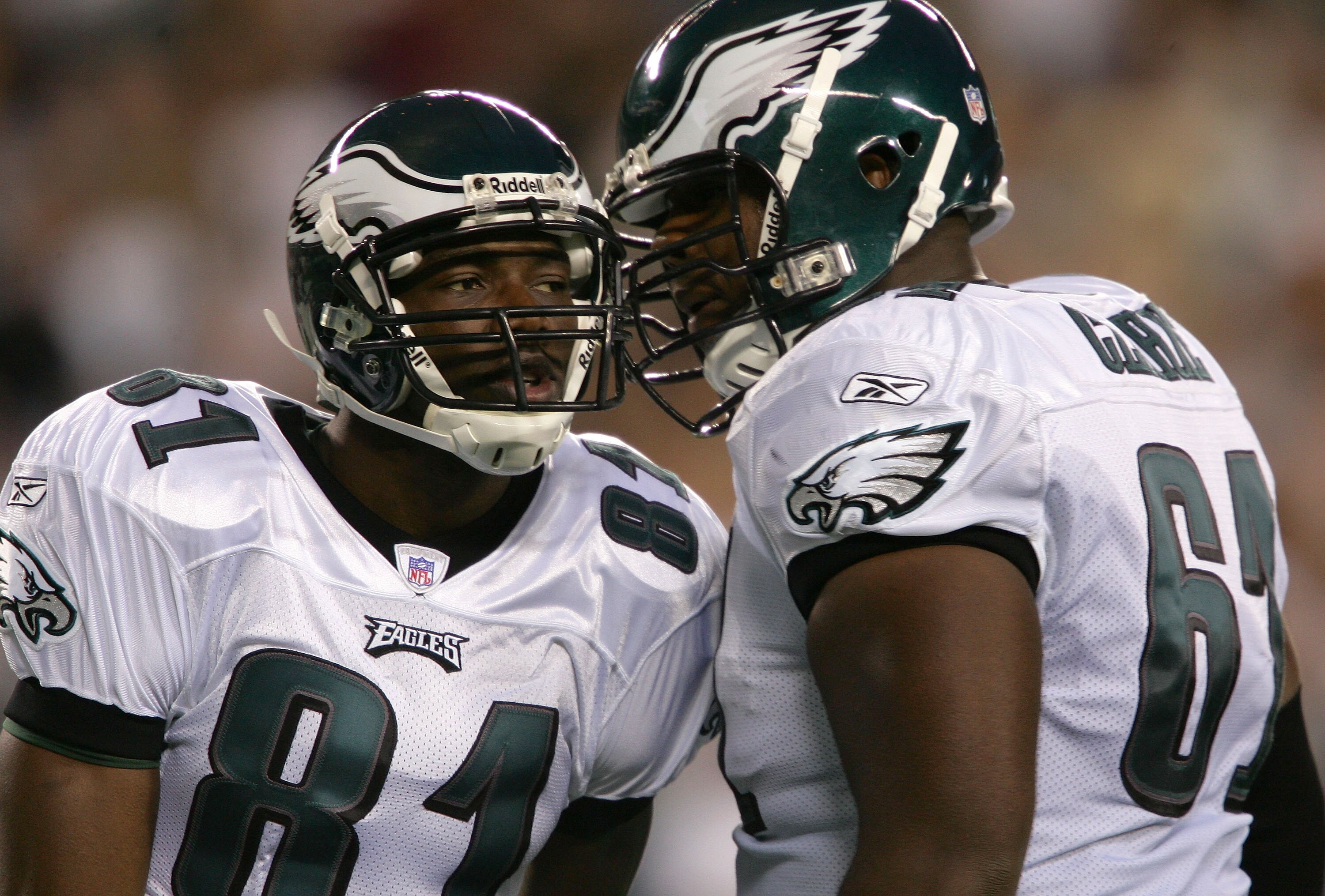 PHILADELPHIA - AUGUST 26:  Wide receiver Terrell Owens #81 of the Philadelphia Eagles celebrates his 64 yard touchdown reception on the first play of the game against the Cincinnati Bengals with teammate Adrien Clarke #61 in the first quarter of their pre