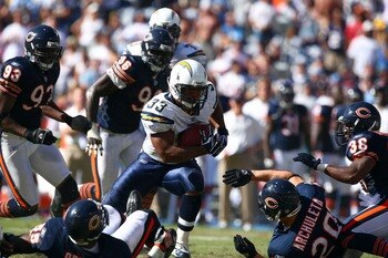 SAN DIEGO - SEPTEMBER 9:  Runningback Michael Turner #33 of the San Diego Chargers runs against the defense of the Chicago Bears at Qualcomm Stadium September 9, 2007 in San Diego, California.  (Photo by Donald Miralle/Getty Images)